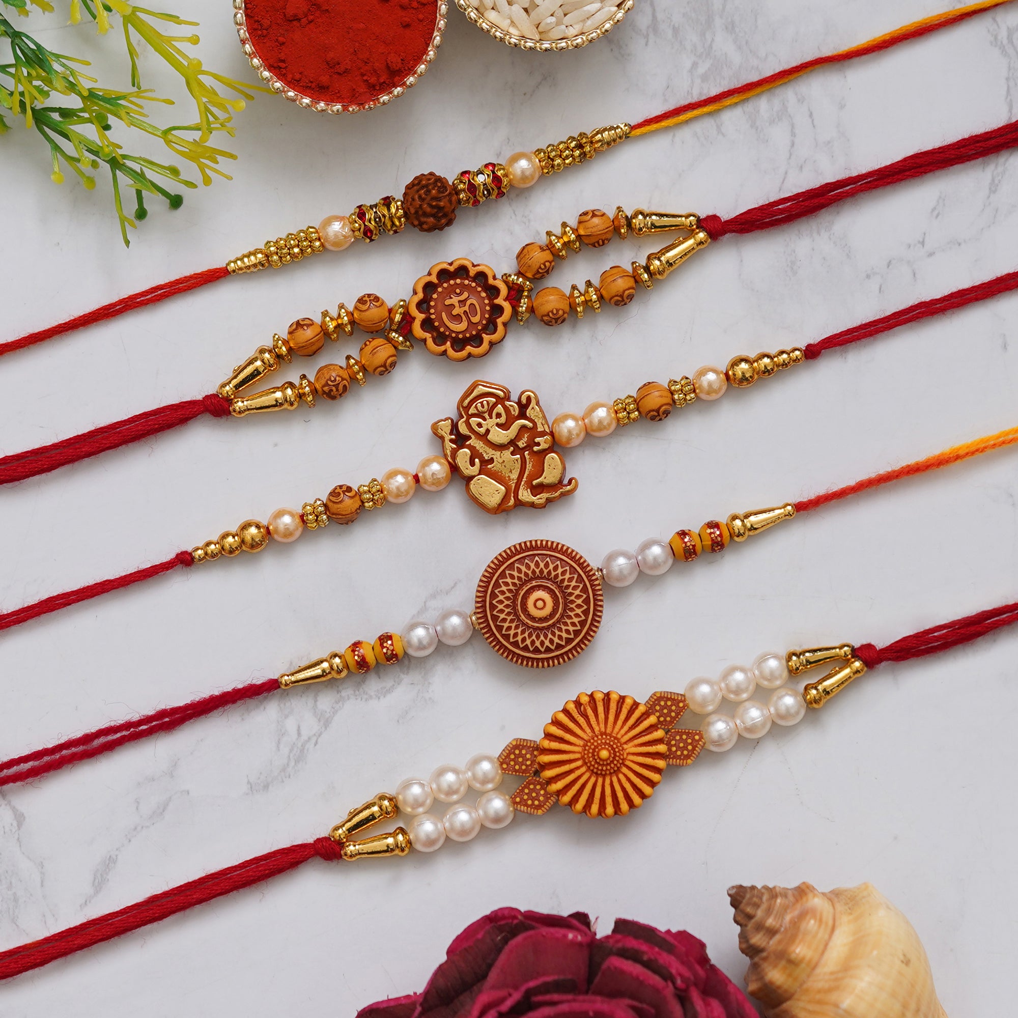 eCraftIndia Multicolor Set of 5 Rudraksha, Om, Ganesha, Flower, Pearls Religious Designer Rakhis with Roli Chawal Pack 1
