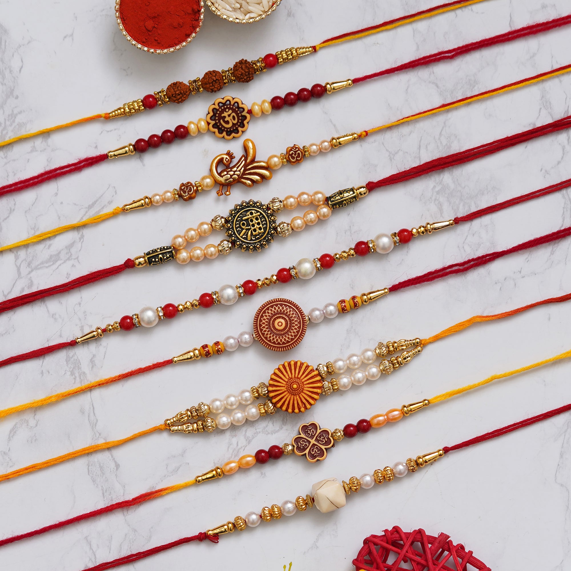 eCraftIndia Set of 9 Shri, Rudraksha, Flower, Peacock, Om, Beads, Pearl Religious Designer Rakhis with Roli Chawal Pack 1