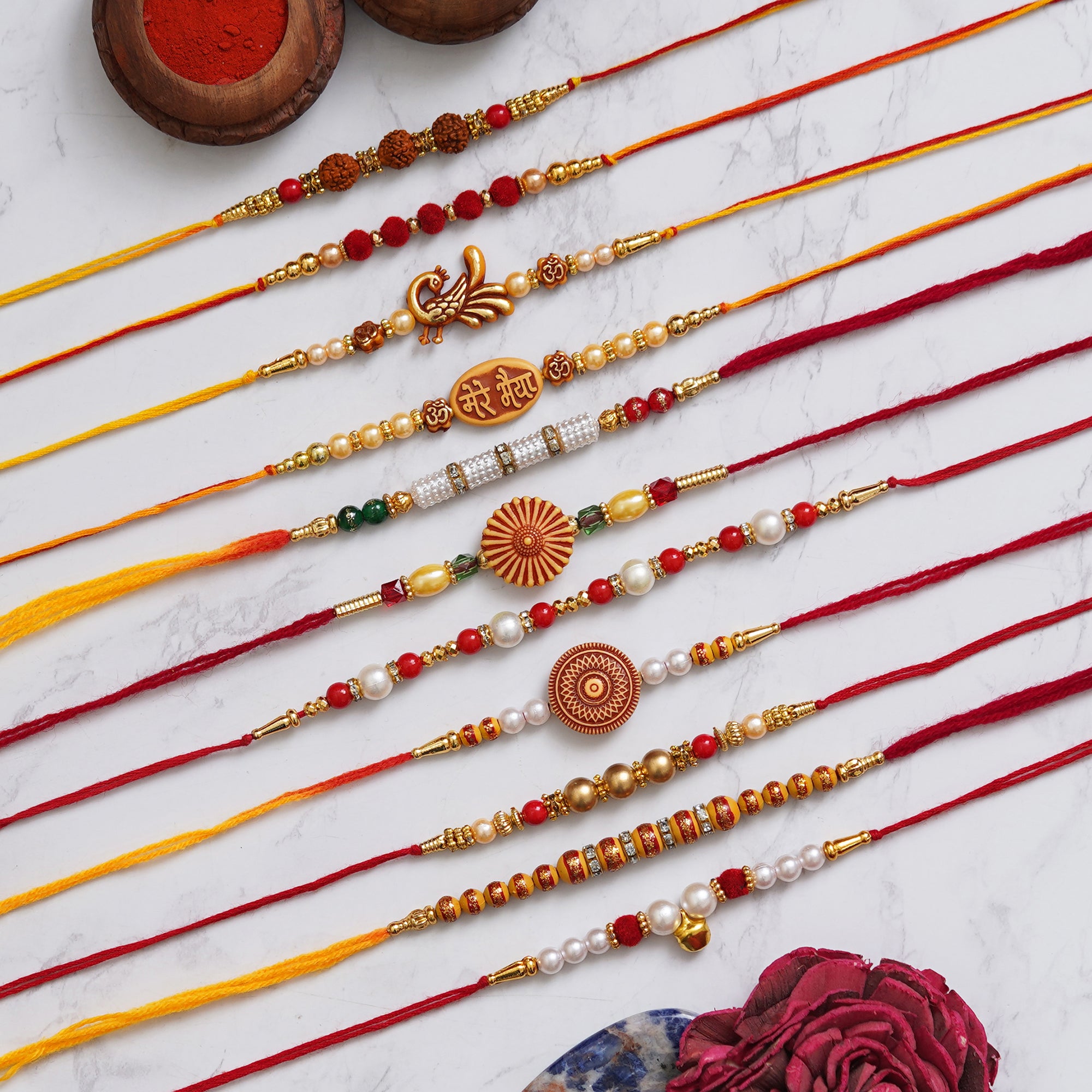eCraftIndia Set of 11 Rudraksha, Peacock, Mere Bhaiya, Flower, Beads, Pearls Designer Rakhis with Roli Chawal Pack 1