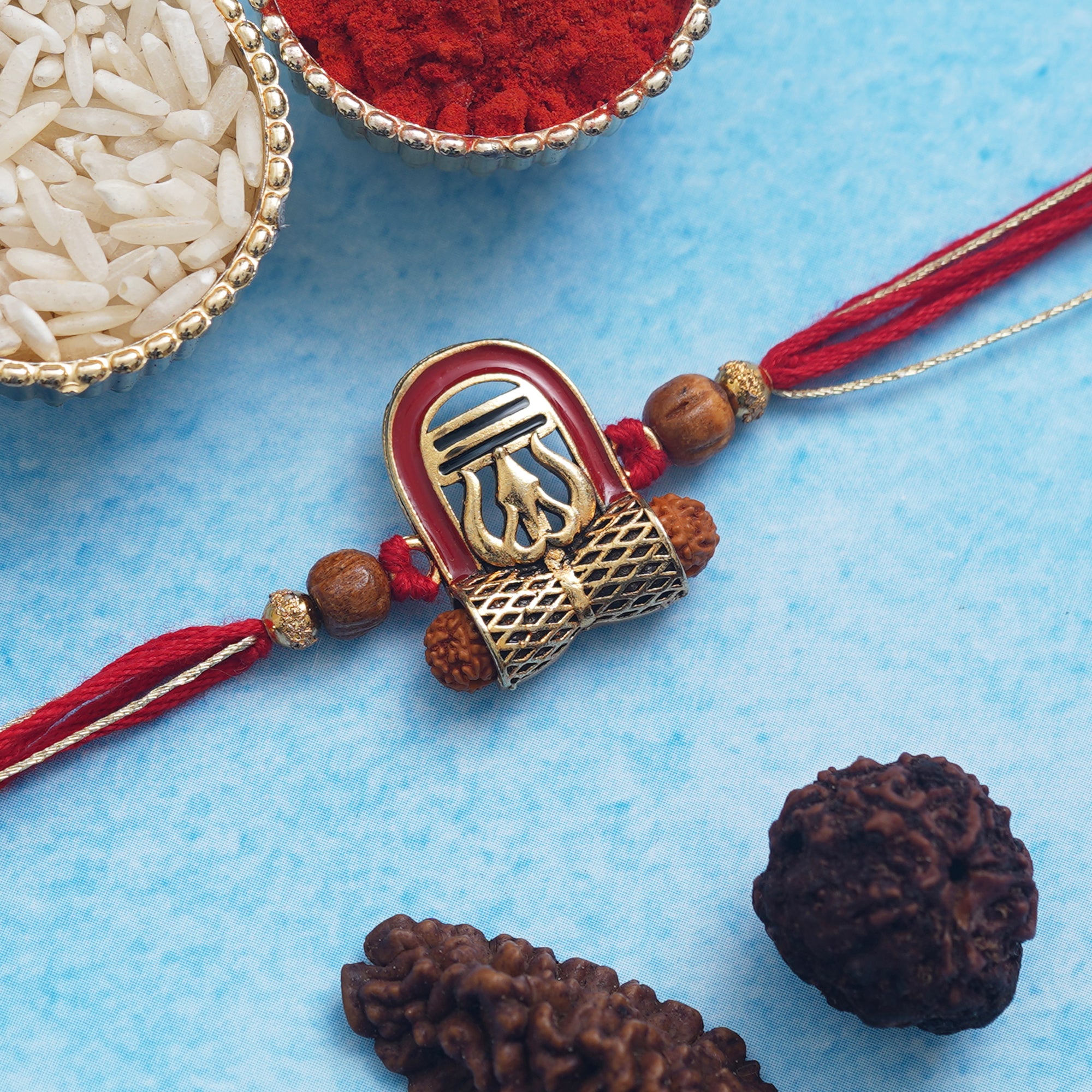 Red, Brown, and Golden Lord Shiva Shivling, Trishul, Damru, and Rudraksha Religious Designer Rakhi, and Roli Chawal Pack 1