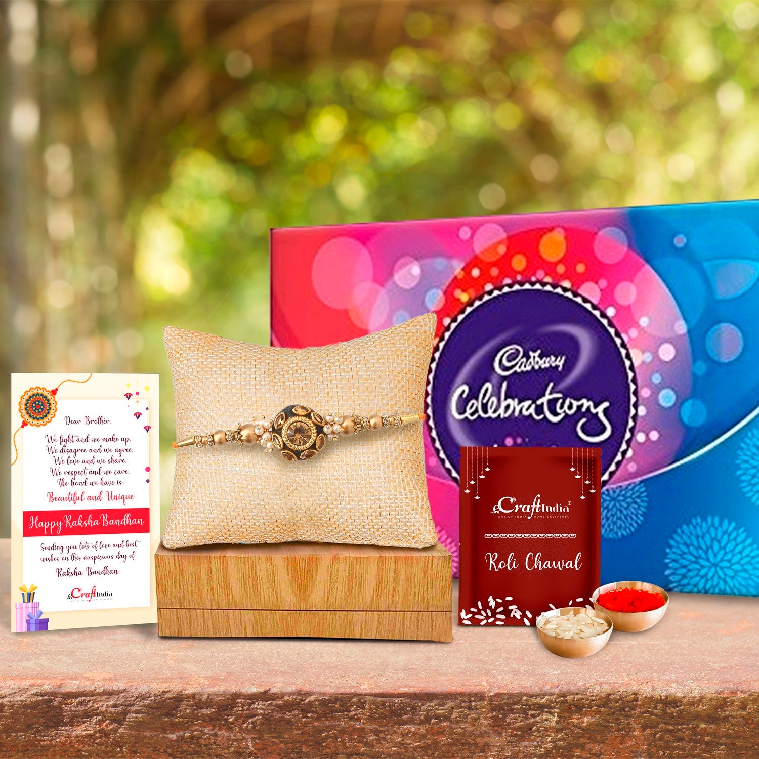Designer Rakhi with Cadbury Celebrations Gift Pack of 7 Assorted Chocolates and Roli Chawal Pack, Best Wishes Greeting Card