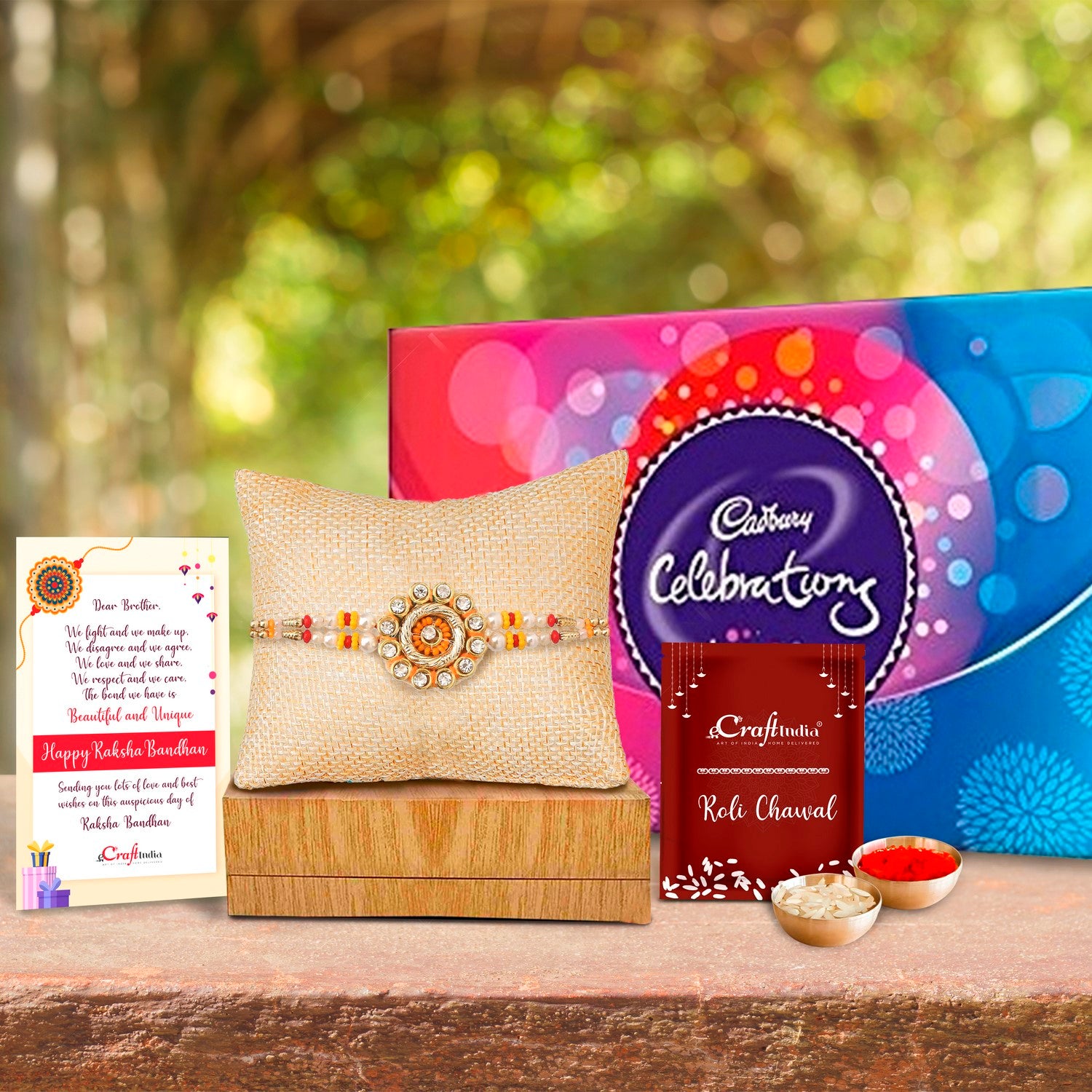 Designer Rakhi with Cadbury Celebrations Gift Pack of 7 Assorted Chocolates and Roli Chawal Pack, Best Wishes Greeting Card