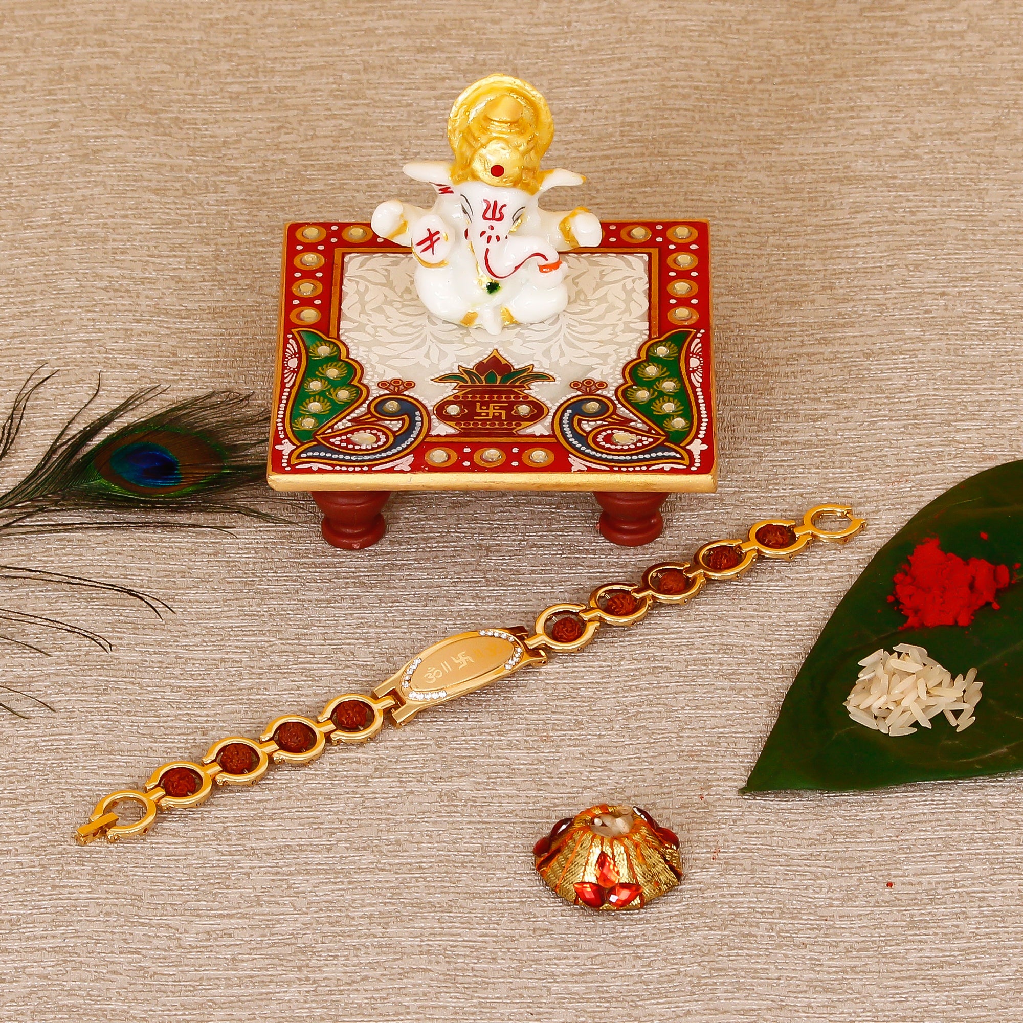 Designer Bracelet Religious Rakhi with Lord Ganesha Marble Chowki and Roli Tikka Matki