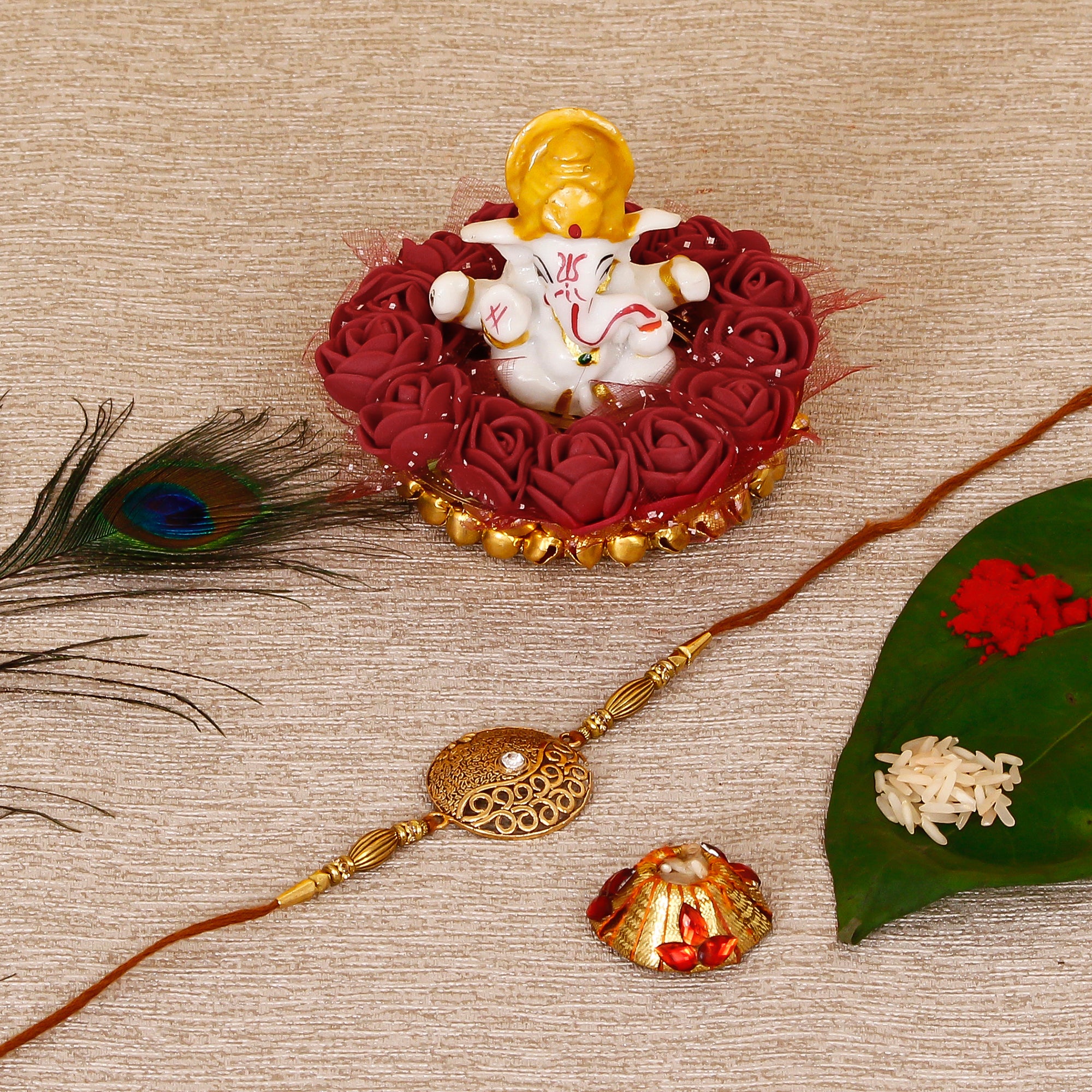 Designer Rakhi with Lord Ganesha Idol on Decorative Plate for Car & Home and Roli Tikka Matki