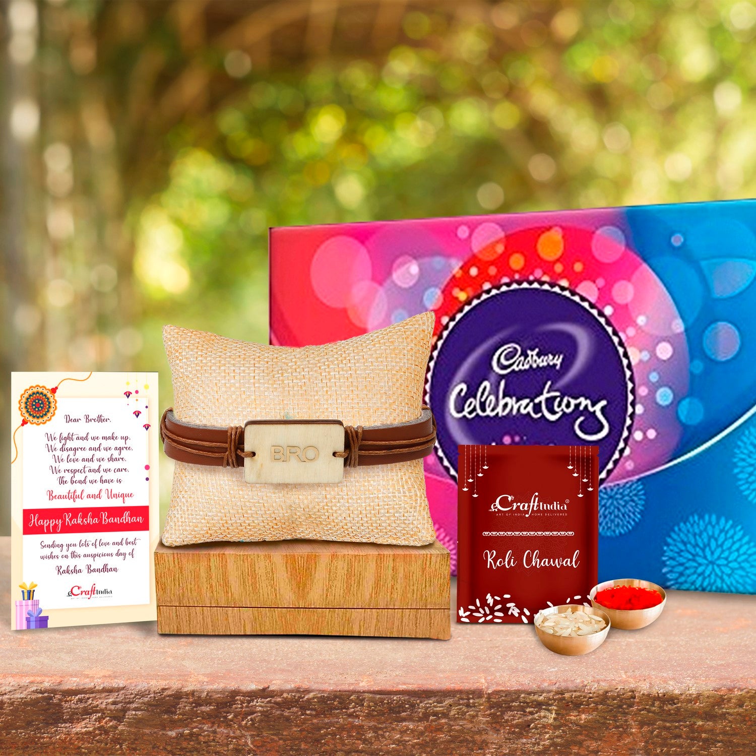 Designer Leather Bracelet BRO Rakhi with Cadbury Celebrations Gift Pack of 7 Assorted Chocolates and Roli Chawal Pack, Best Wishes Greeting Card