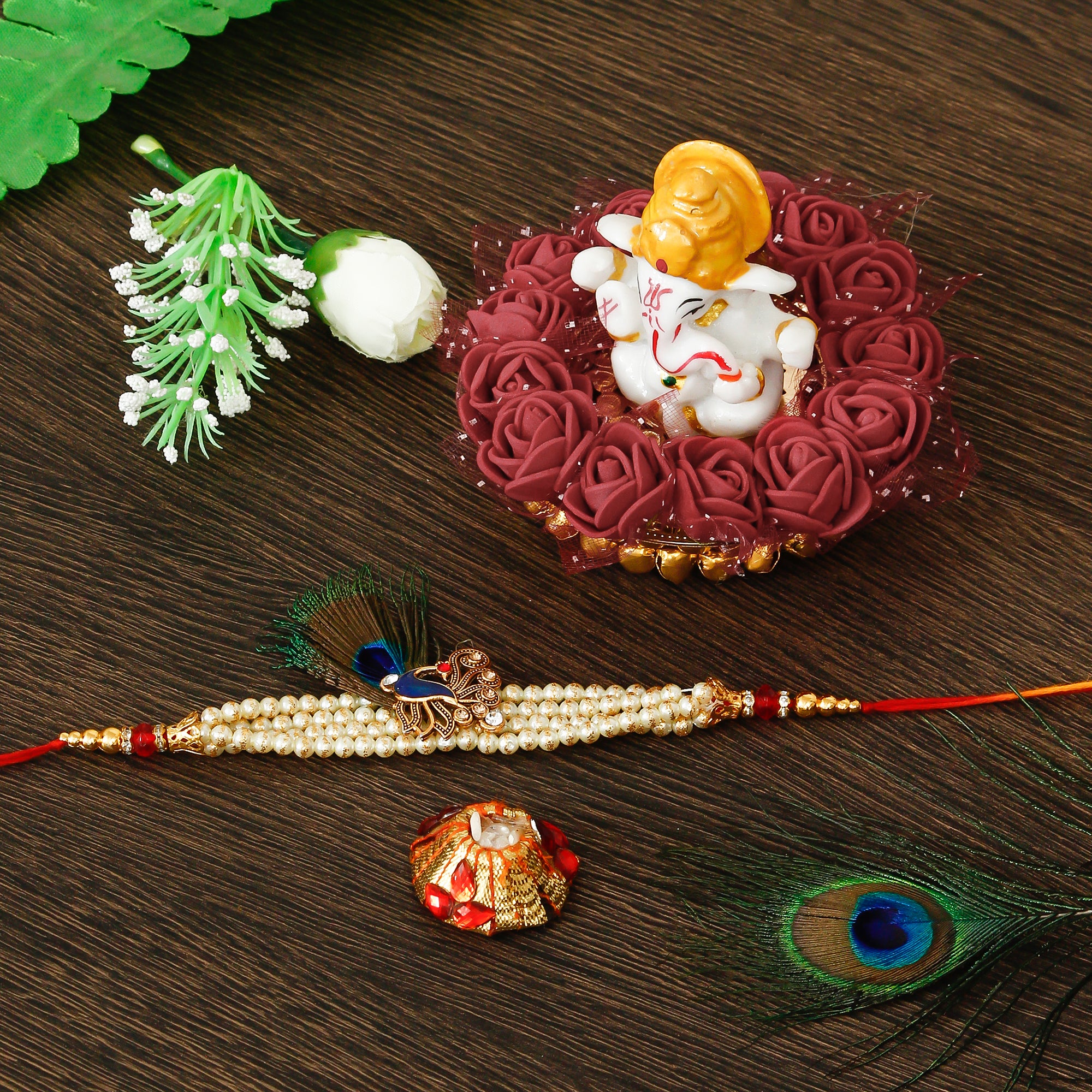 Designer Pearl Morpankh Rakhi with Lord Ganesha Idol on Decorative Plate for Car & Home and Roli Tikka Matki