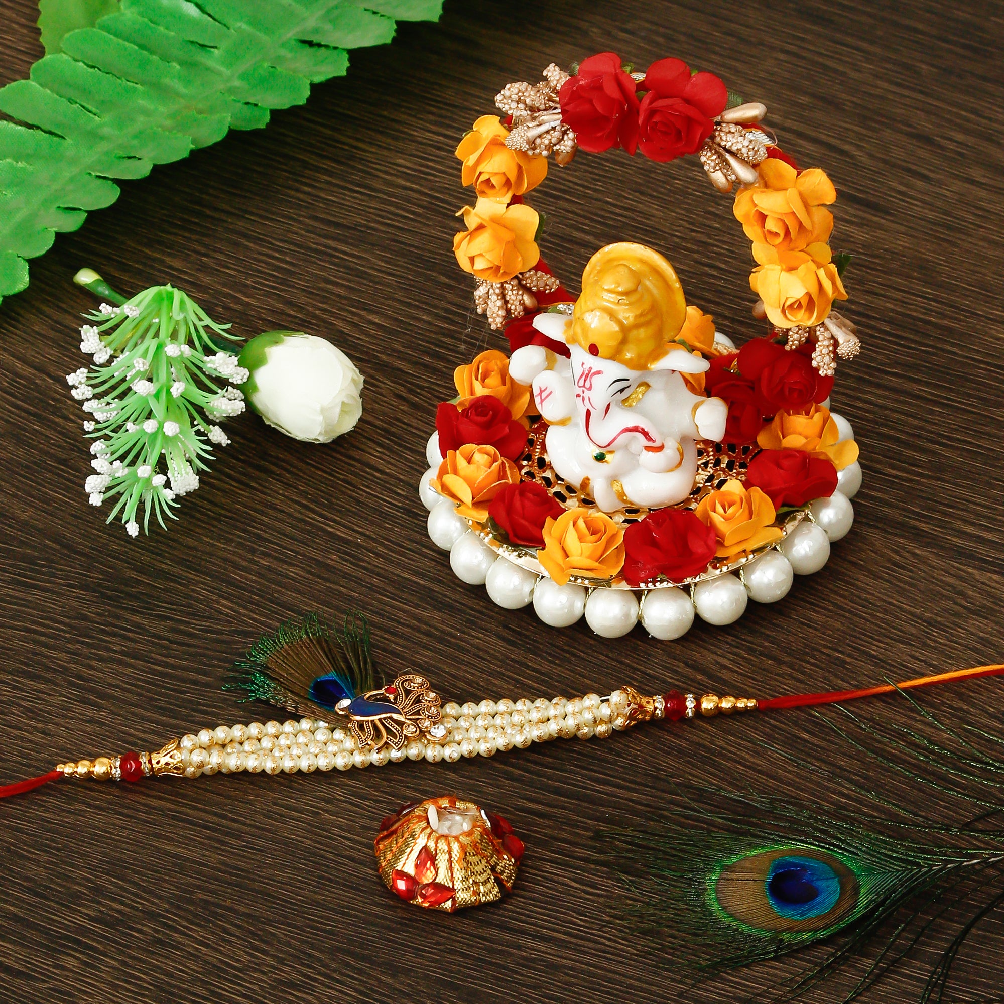 Designer Pearl Morpankh Rakhi with Lord Ganesha Idol on Decorative Plate for Car & Home and Roli Tikka Matki