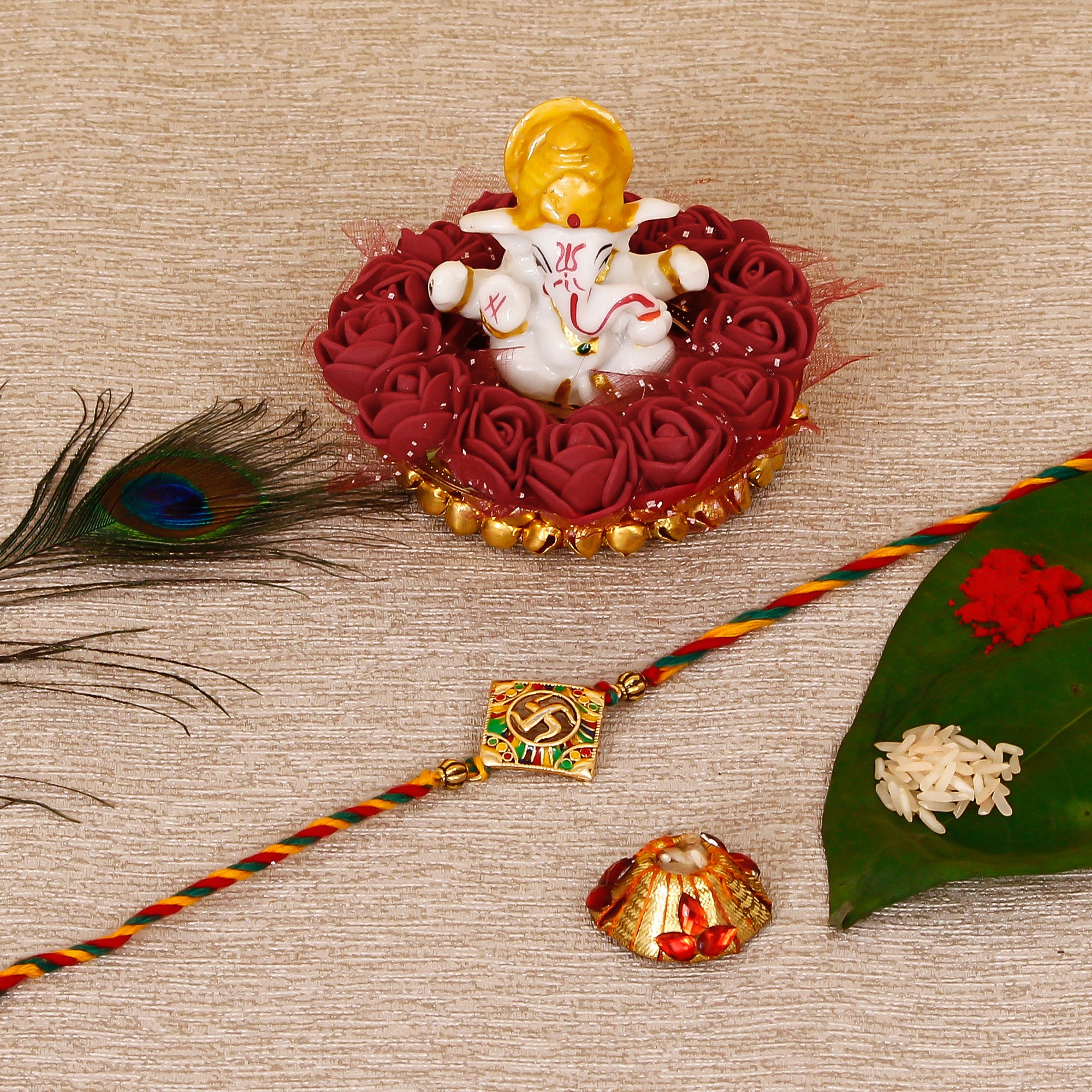 Designer Religious Swastik Rakhi with Lord Ganesha Idol on Decorative Plate for Car & Home and Roli Tikka Matki