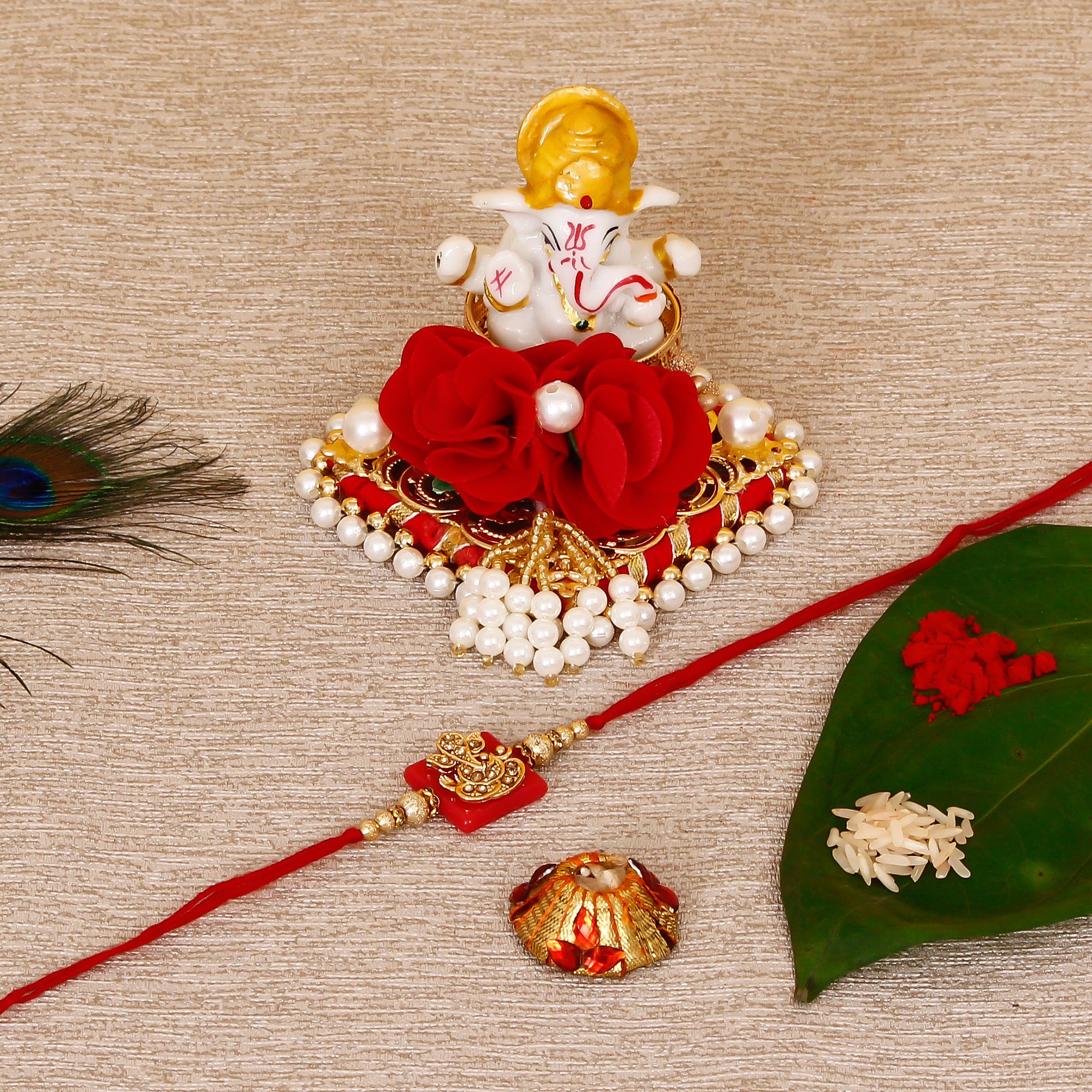 Designer Religious Ganesha Rakhi with Lord Ganesha Idol on Decorative Plate for Car & Home and Roli Tikka Matki