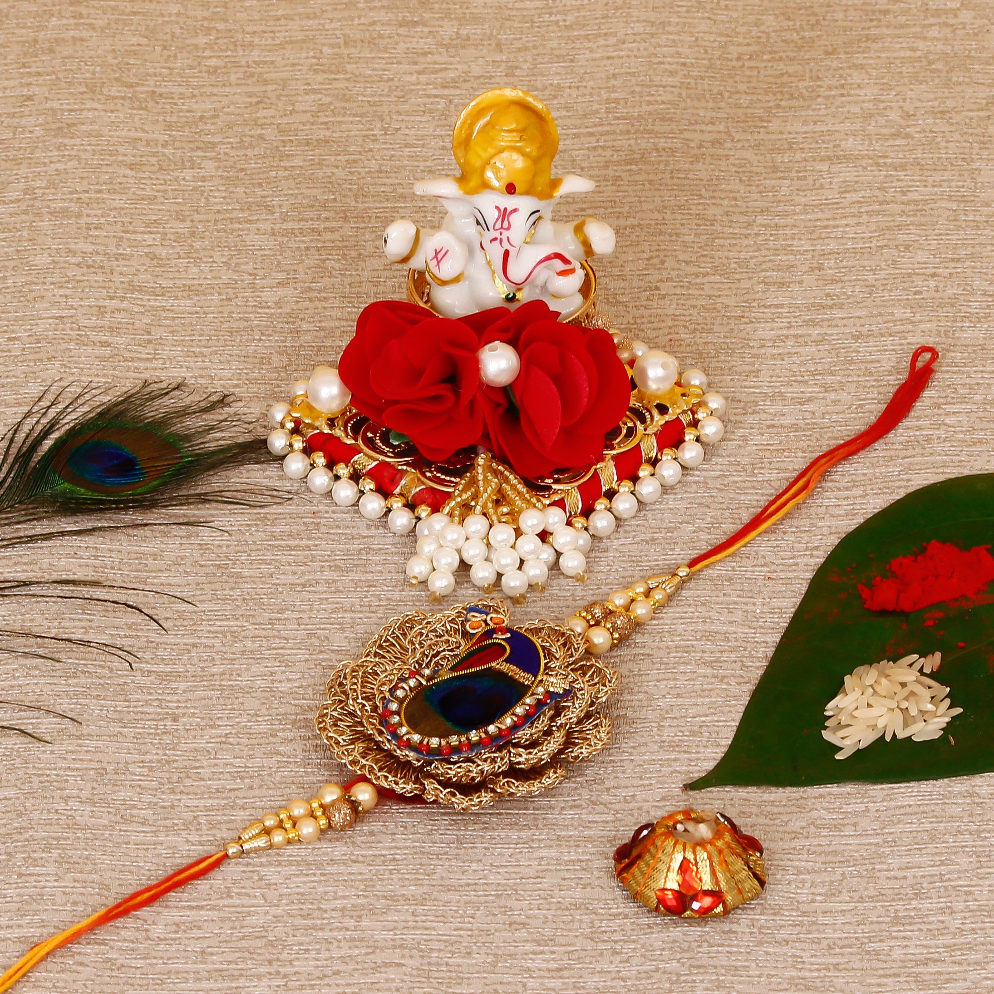 Designer Peacock Rakhi with Lord Ganesha Idol on Decorative Plate for Car & Home and Roli Tikka Matki