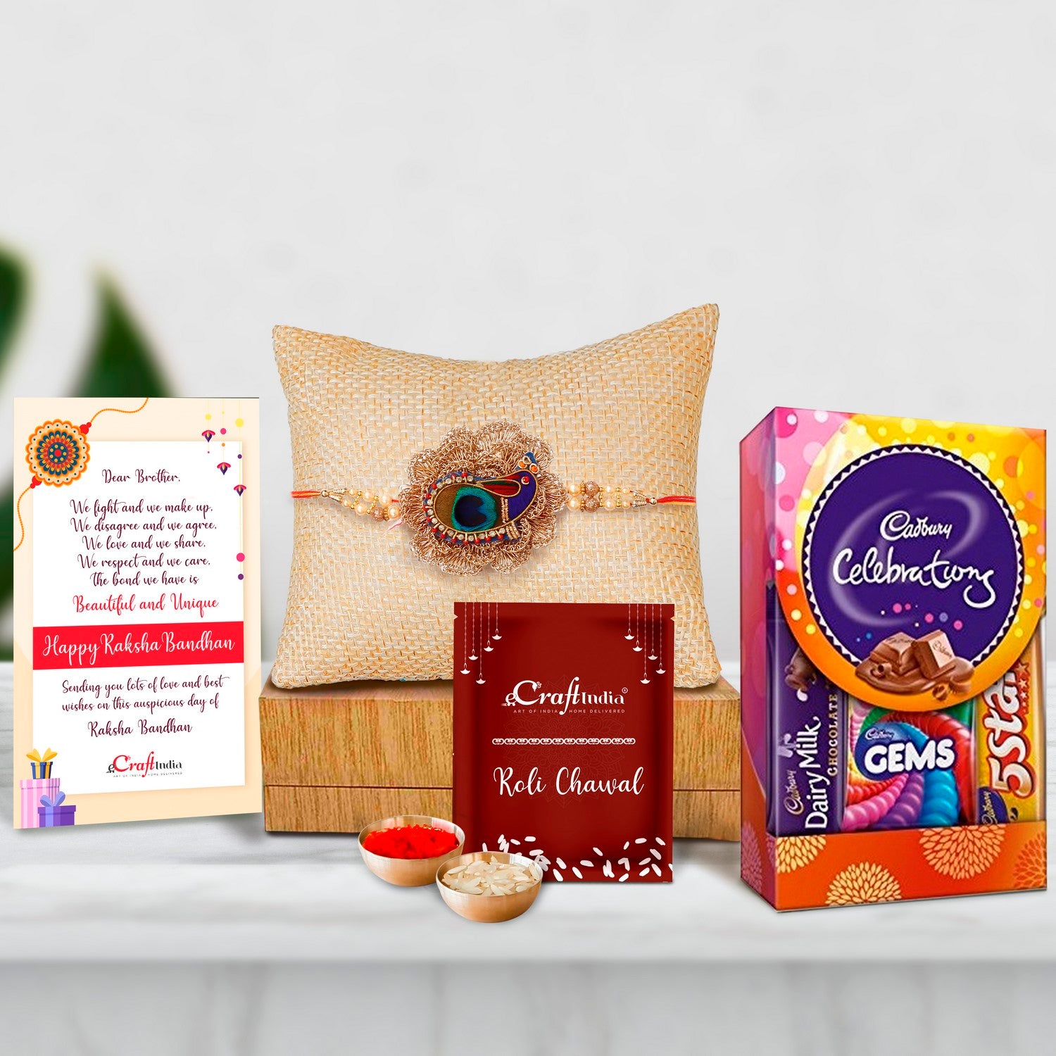 Designer Peacock Rakhi with Cadbury Celebrations Gift Pack of 5 Assorted Chocolates and Roli Chawal Pack, Best Wishes Greeting Card