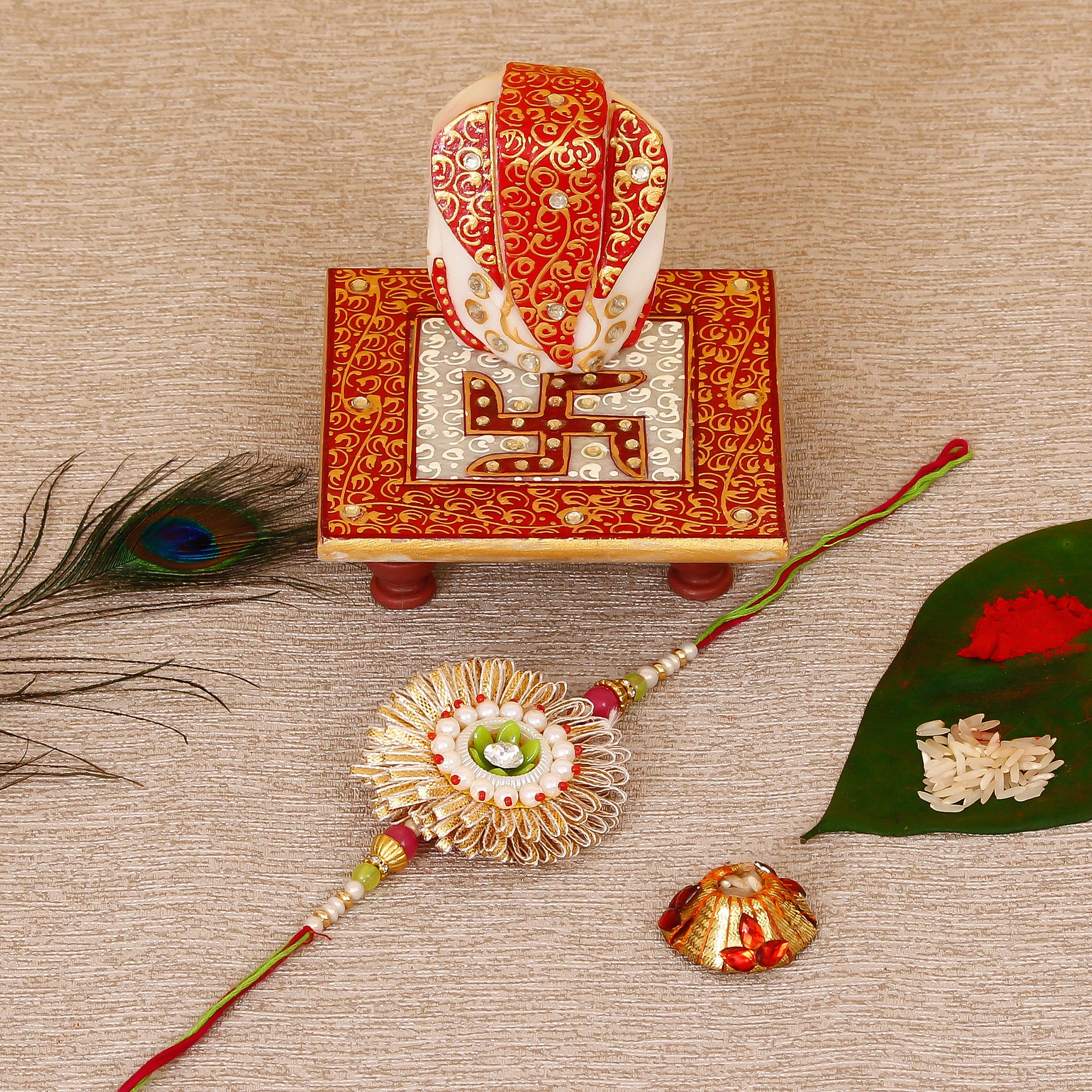 Designer Rakhi with Ridhi Sidhi Marble chowki and Roli Tikka Matki