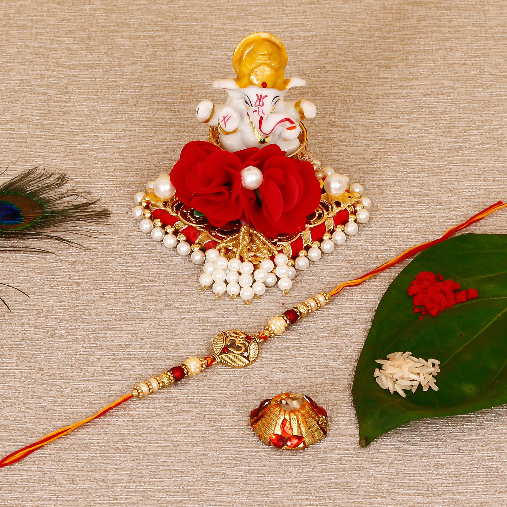 Designer OM Rakhi with Lord Ganesha Idol on Decorative Plate for Car & Home and Roli Tikka Matki