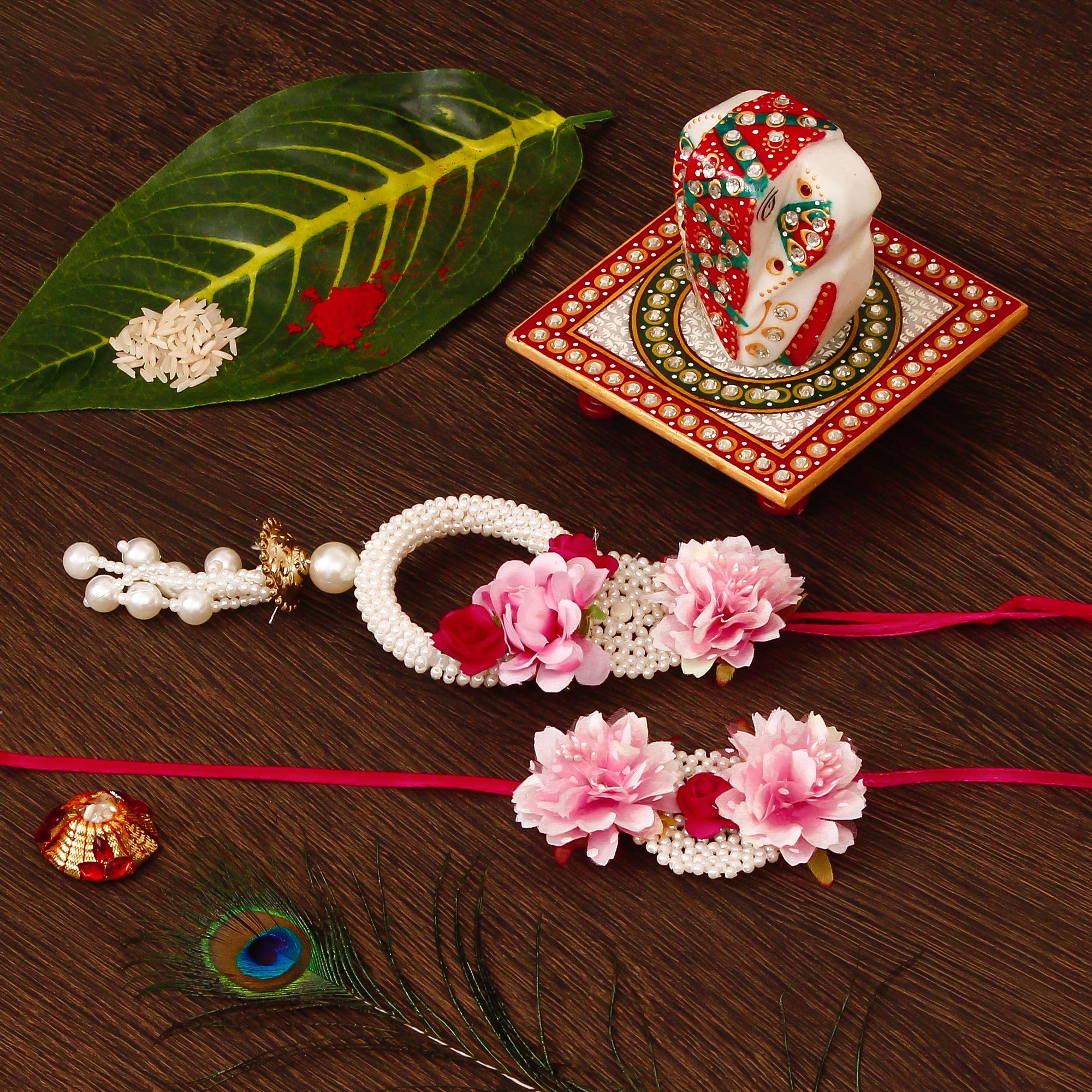 Floral Bhaiya Bhabhi Rakhi with Lord Ganesha on Kundan Studded Marble Chowki and Roli Tikka Matki