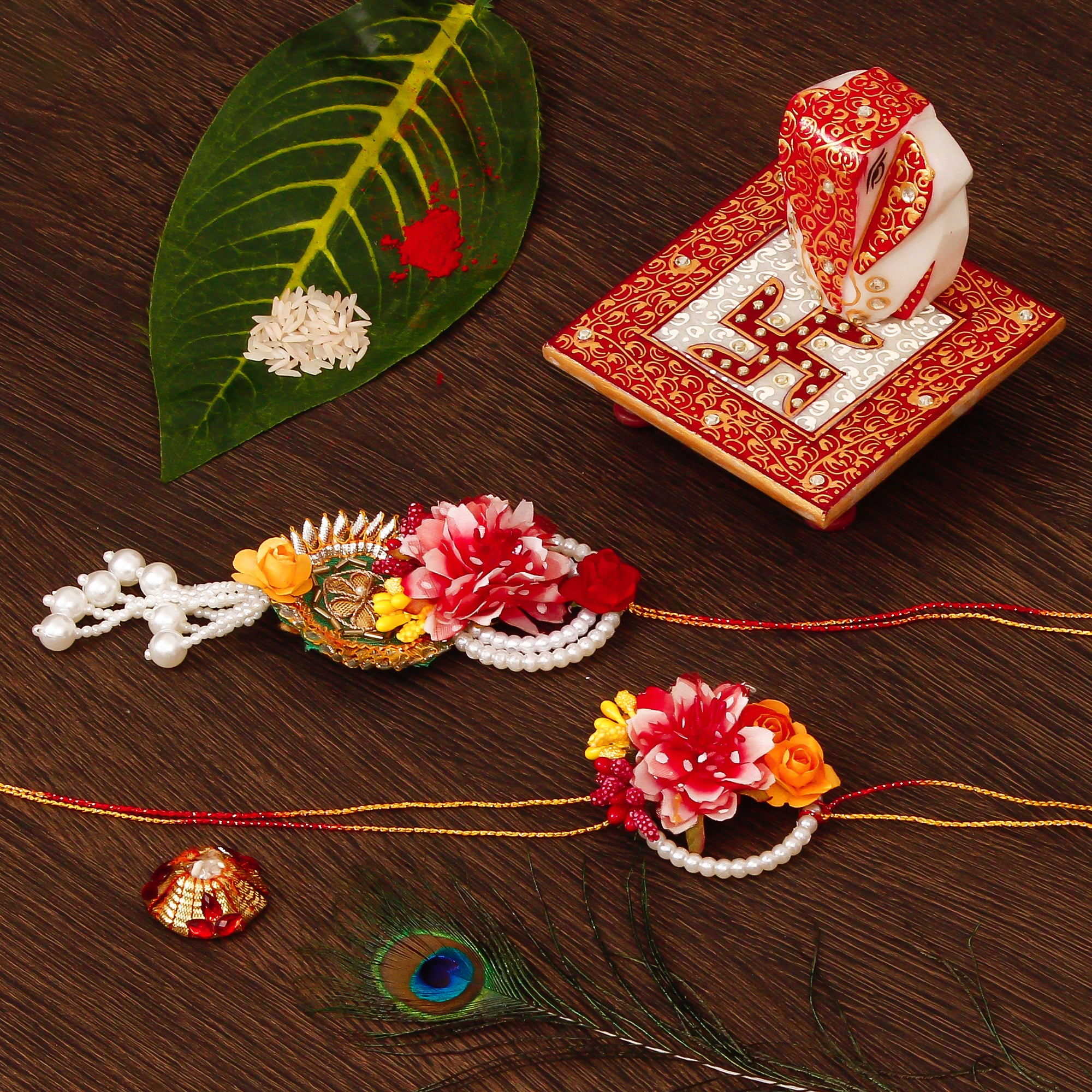 Floral Bhaiya Bhabhi Rakhi with Ridhi Sidhi Marble chowki and Roli Tikka Matki