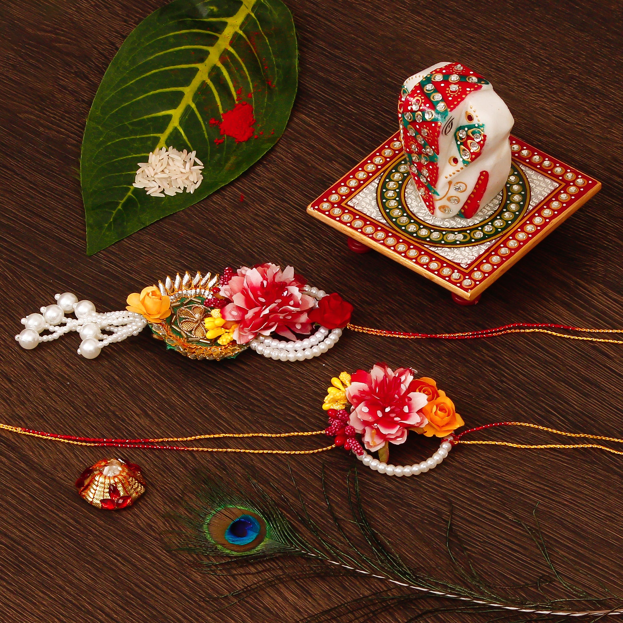 Floral Bhaiya Bhabhi Rakhi with Lord Ganesha on Kundan Studded Marble Chowki and Roli Tikka Matki
