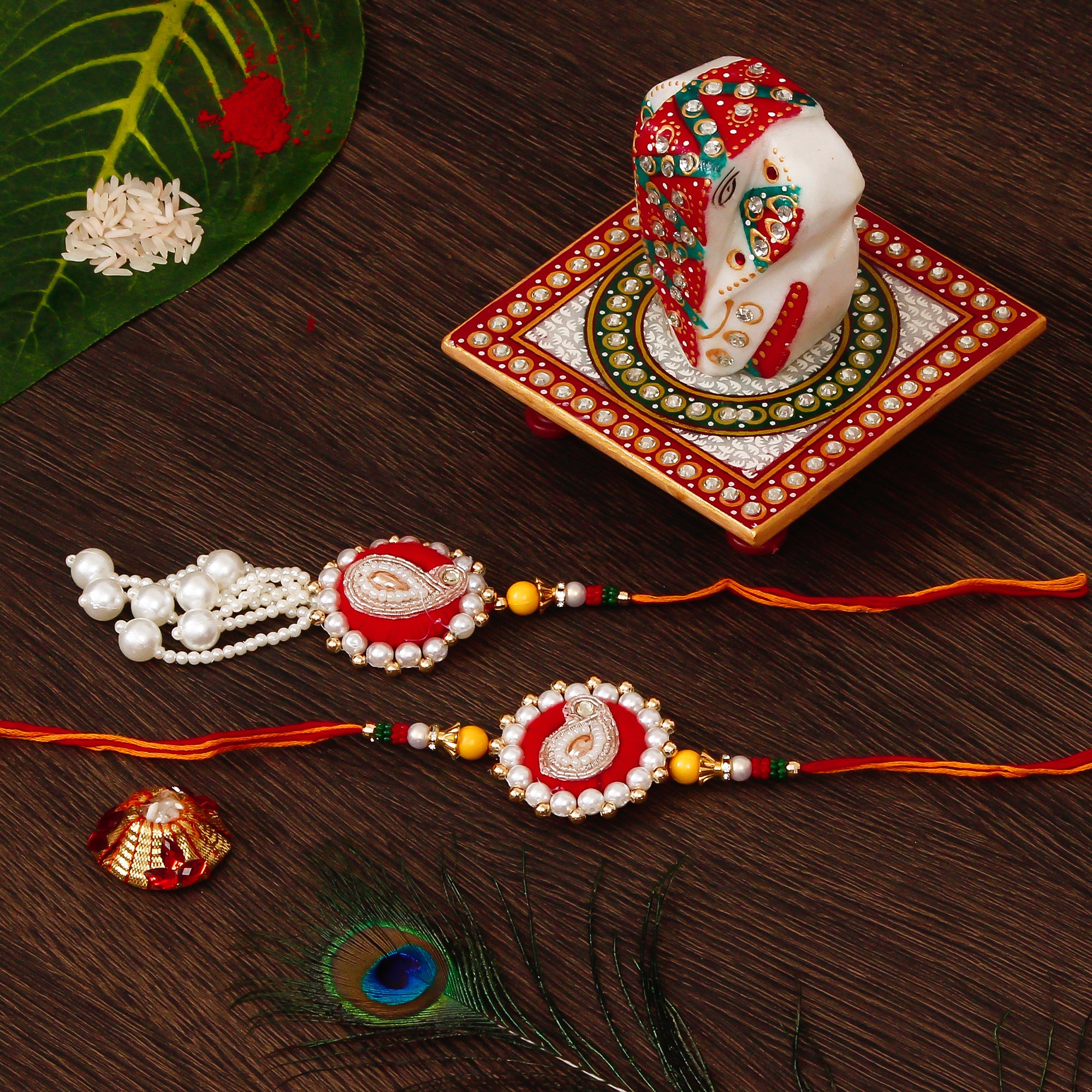 Bhaiya Bhabhi Rakhi with Lord Ganesha on Kundan Studded Marble Chowki and Roli Tikka Matki