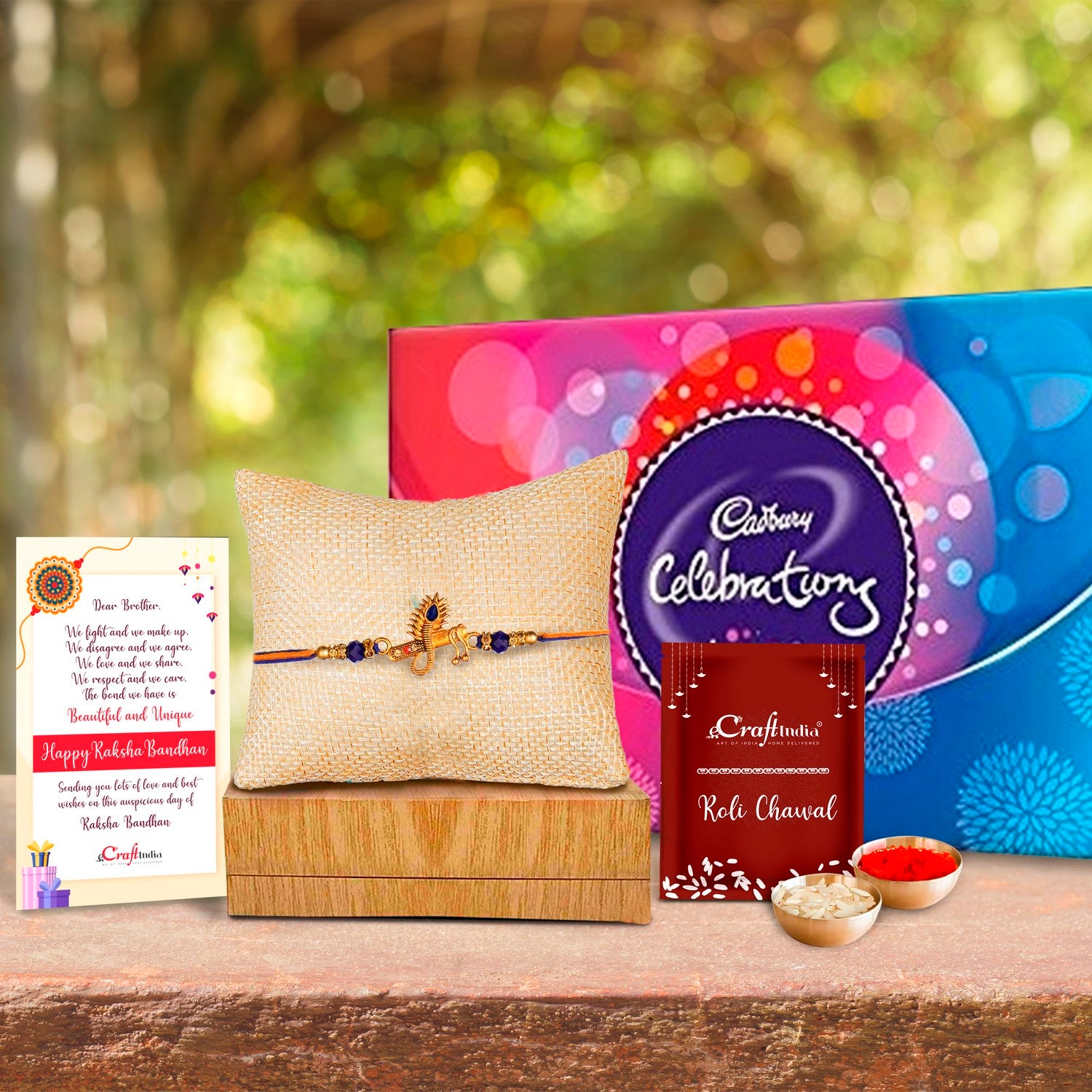 Designer Mor Pankh with Flute Rakhi with Cadbury Celebrations Gift Pack of 7 Assorted Chocolates and Roli Chawal Pack, Best Wishes Greeting Card