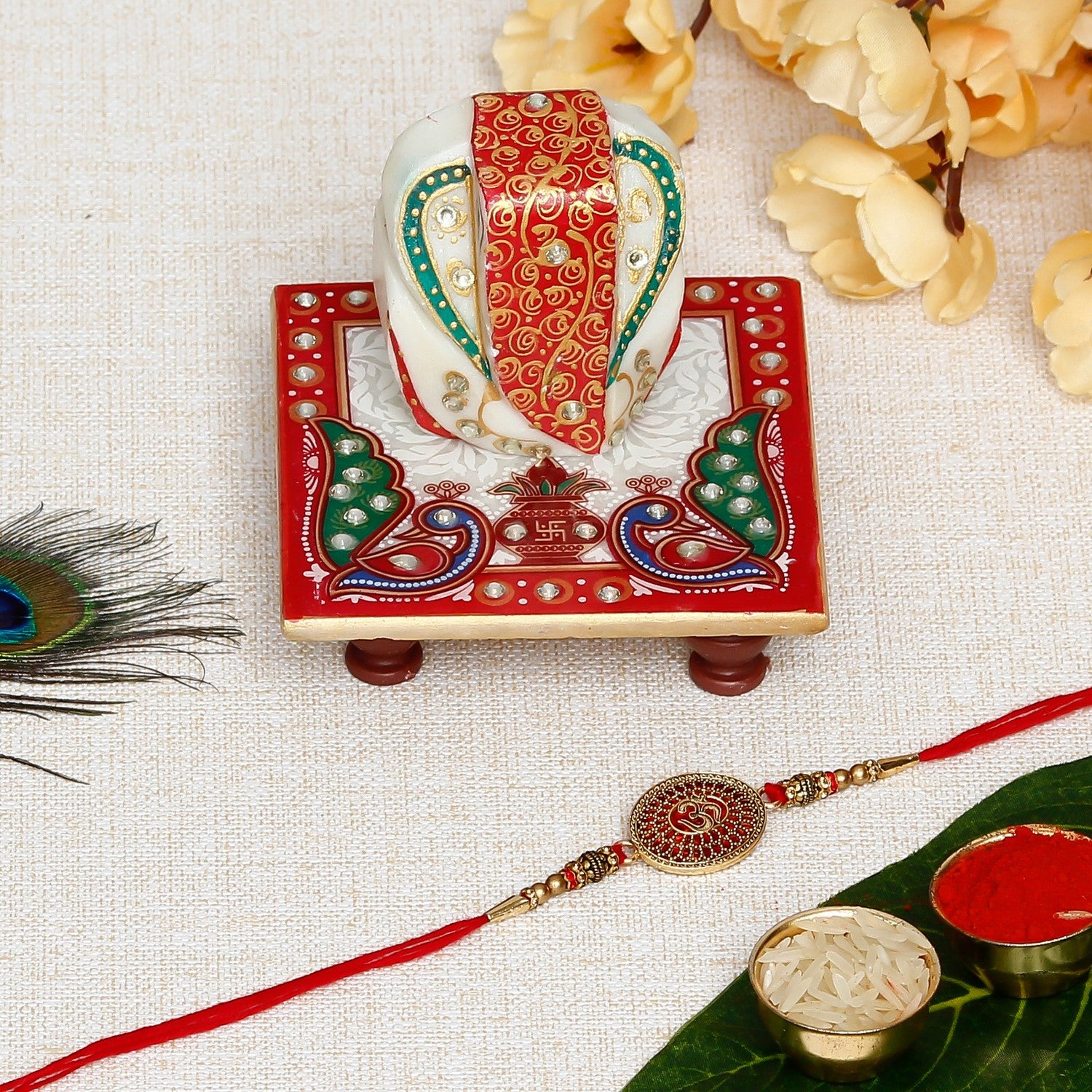 Designer Om Rakhi with Lord Ganesha on Marble Chowki and Roli Chawal Pack