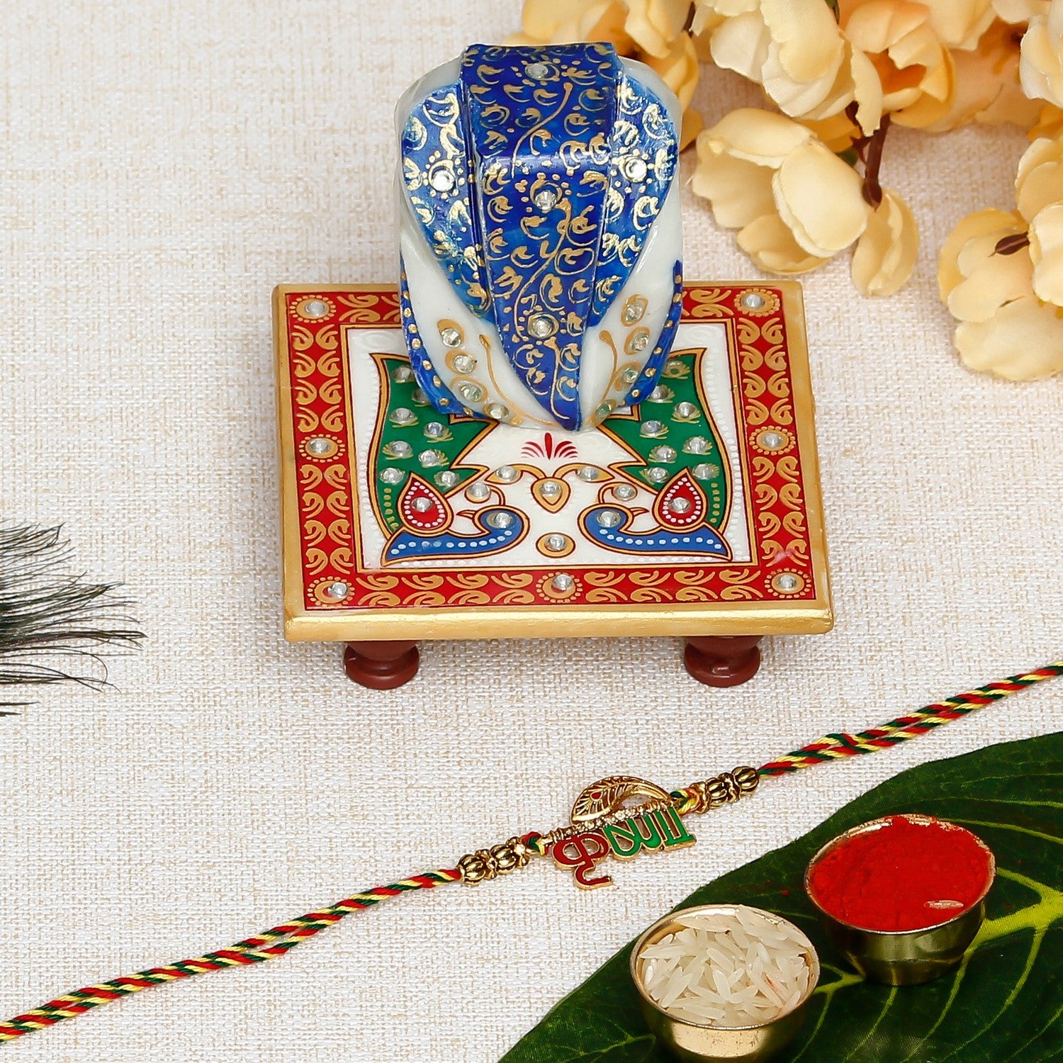 Designer Krishna Rakhi with Lord Ganesha on Marble Chowki and Roli Chawal Pack