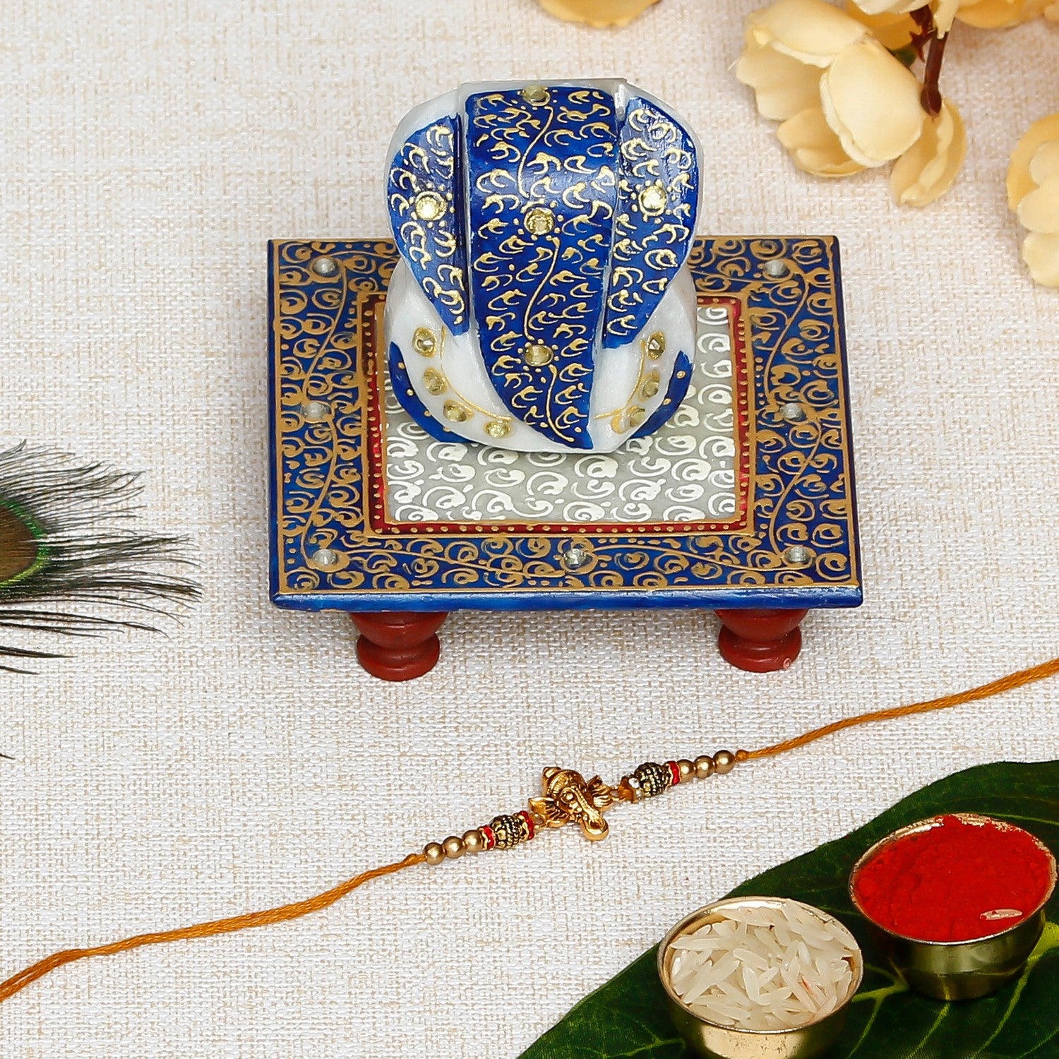 Designer Ganesha Rakhi with Lord Ganesha Marble Chowki and Roli Chawal Pack