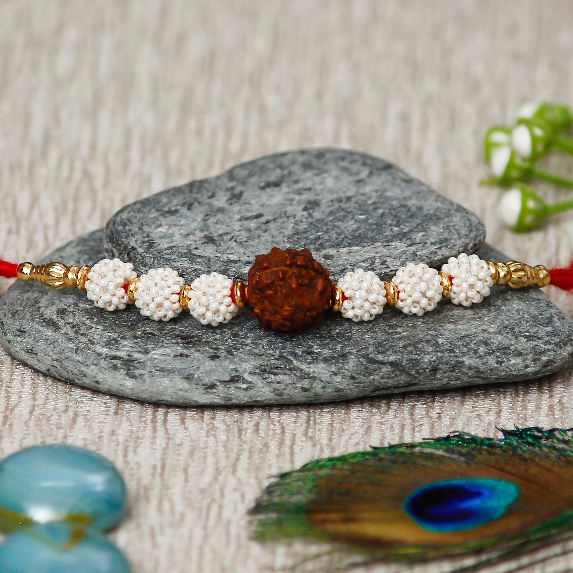 Rudraksh Rakhi with Handcrafted Ganesha Showpiece and Roli Chawal Pack 1