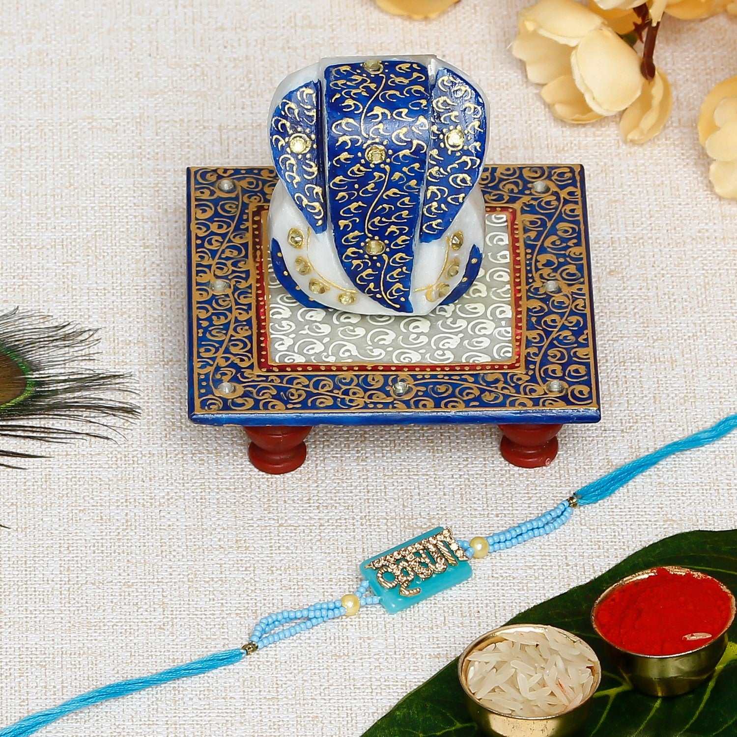 Designer Stone Krishna Rakhi with Lord Ganesha Marble Chowki and Roli Chawal Pack