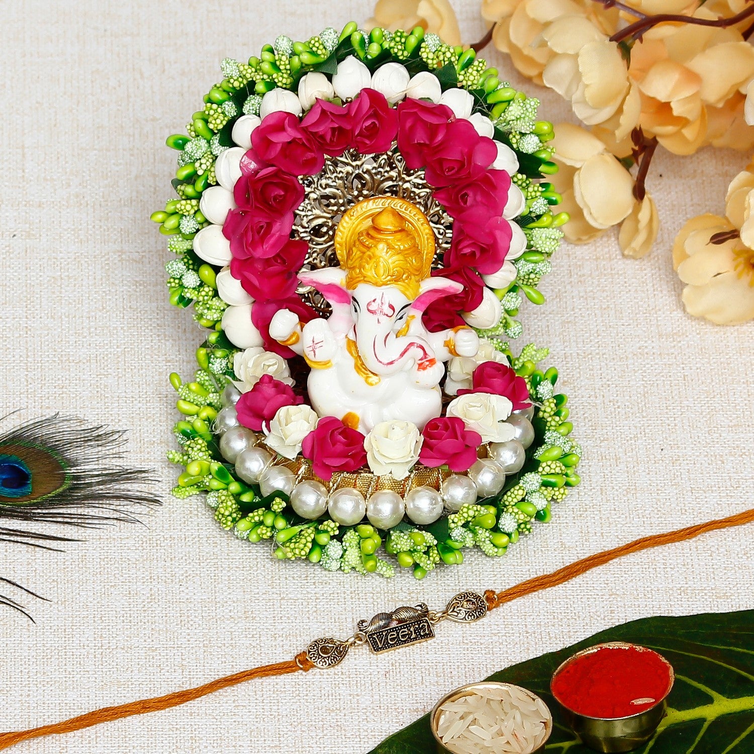 Designer Veera Rakhi with Lord Ganesha Idol on Decorative Handcrafted Green Floral Plate for Home and Car and Roli Chawal Pack