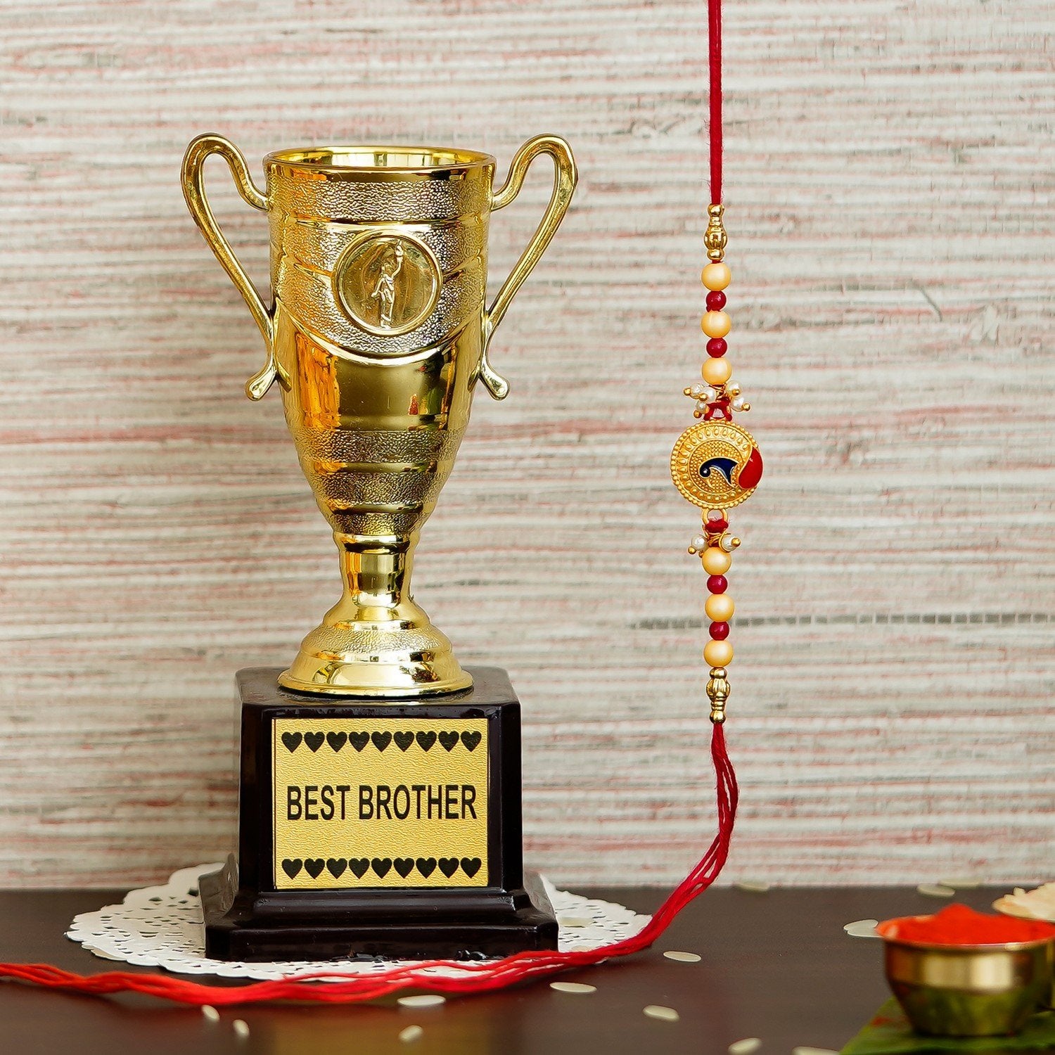 Designer Peacock Rakhi with Best Brother Trophy and Roli Chawal Pack