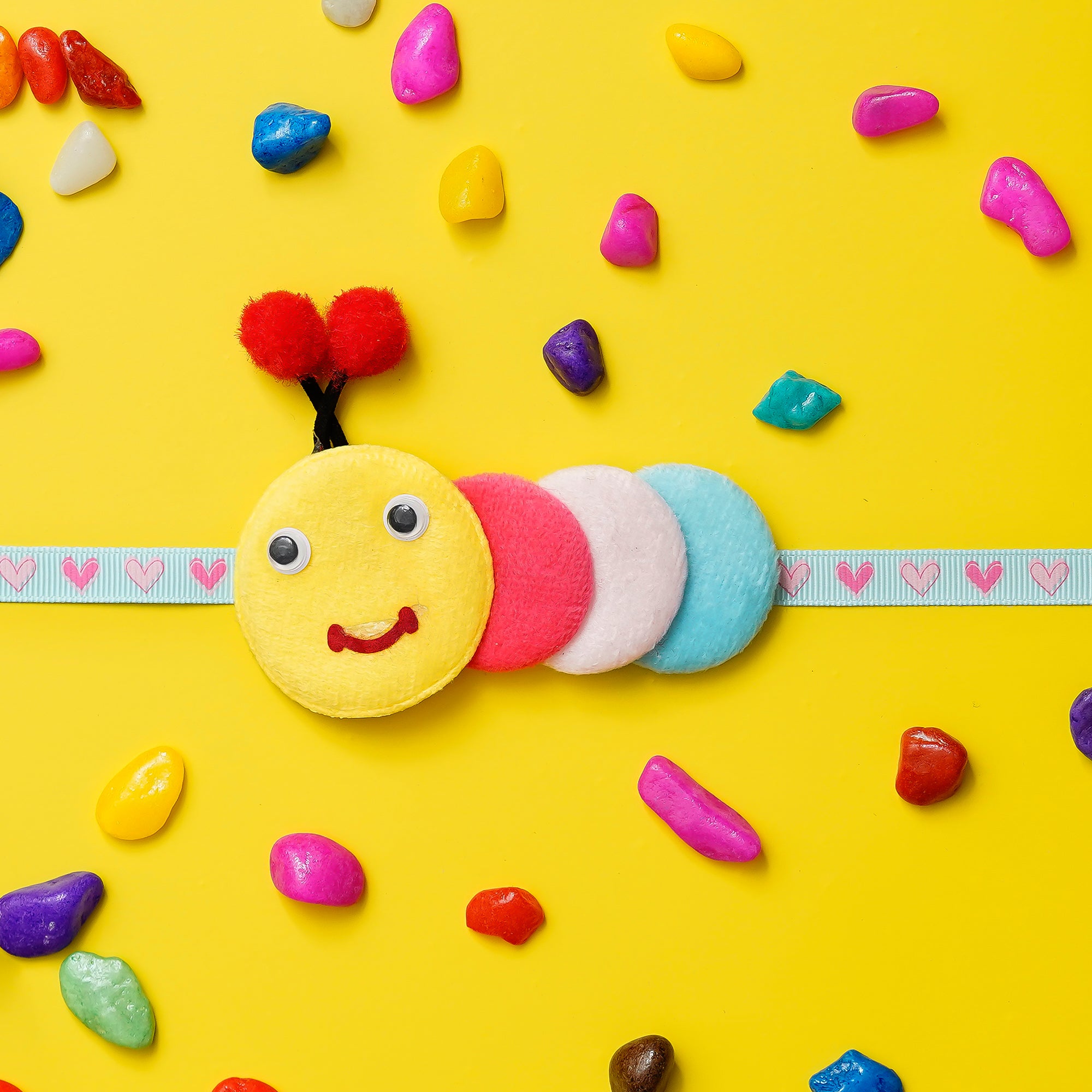 Kids Caterpillar Rakhi with Ferrero Rocher (16 pcs) and Roli Chawal Pack, Best Wishes Greeting Card 1