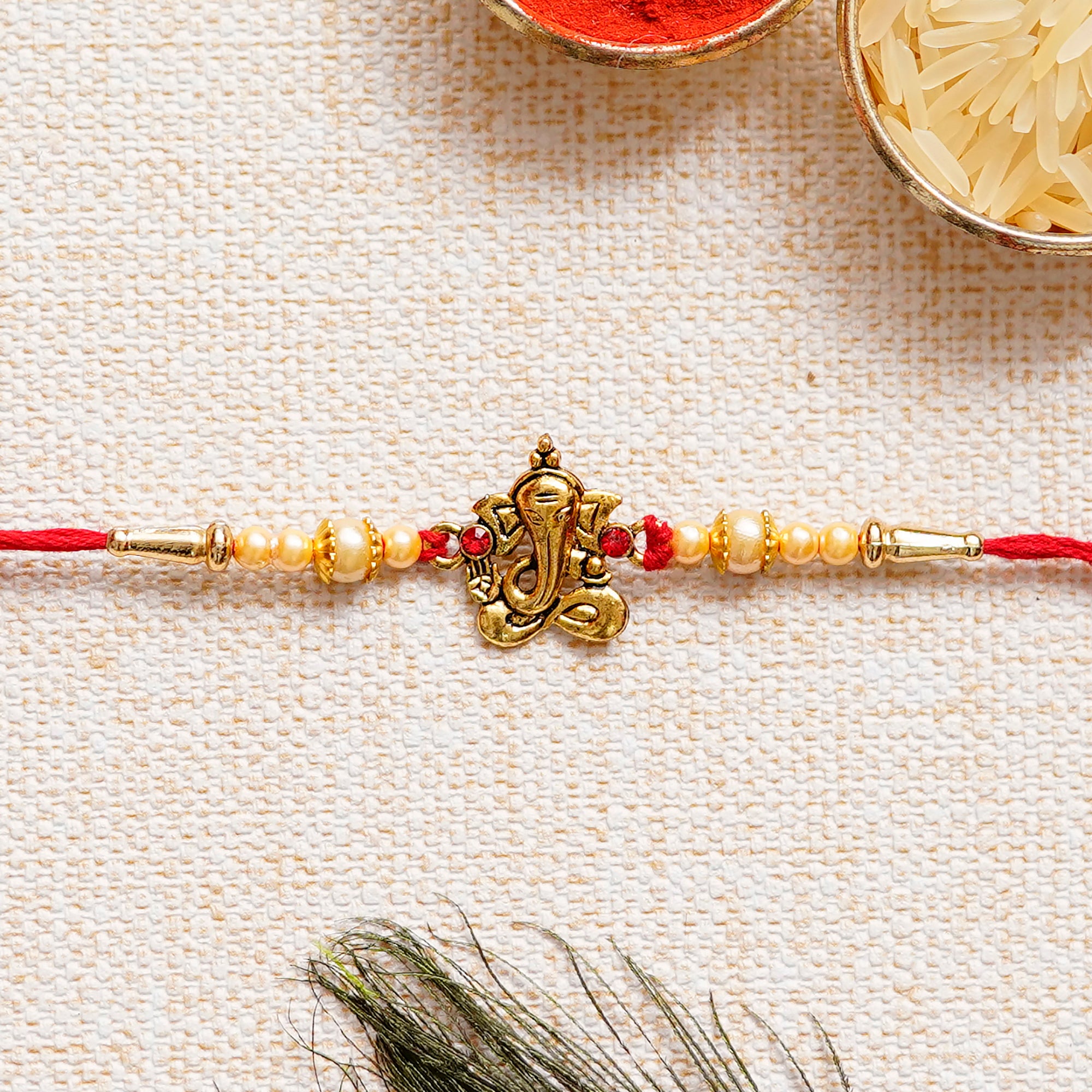 Designer Ganesha Rakhi with Lord Ganesha on Marble Chowki and Roli Chawal Pack 1