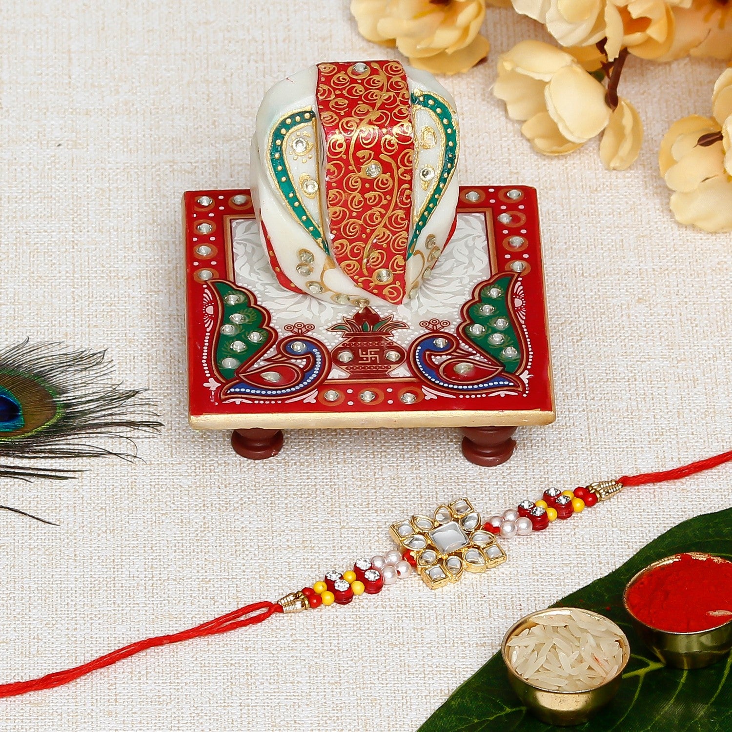 Designer Stone Work Rakhi with Lord Ganesha on Marble Chowki and Roli Chawal Pack