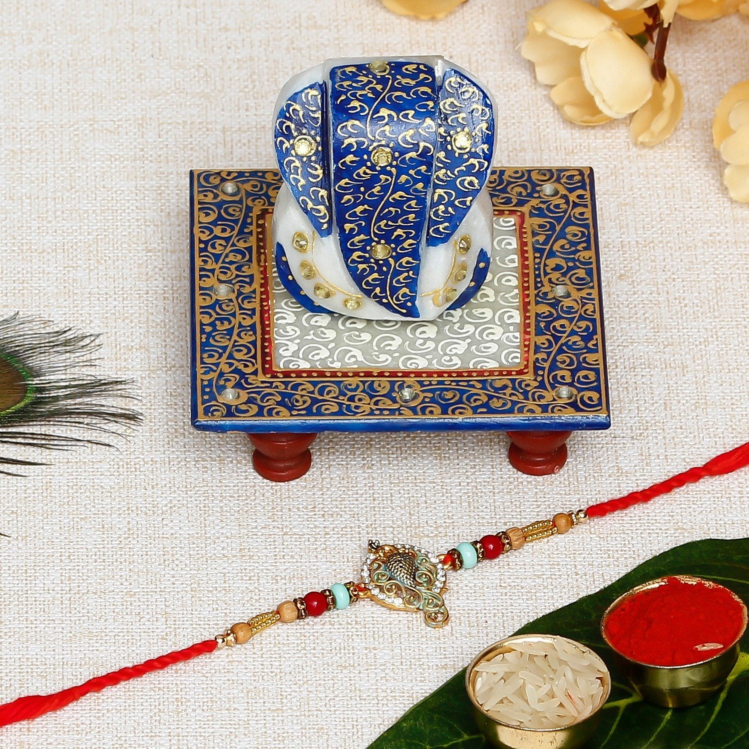 Designer Peacock Rakhi with Lord Ganesha Marble Chowki and Roli Chawal Pack