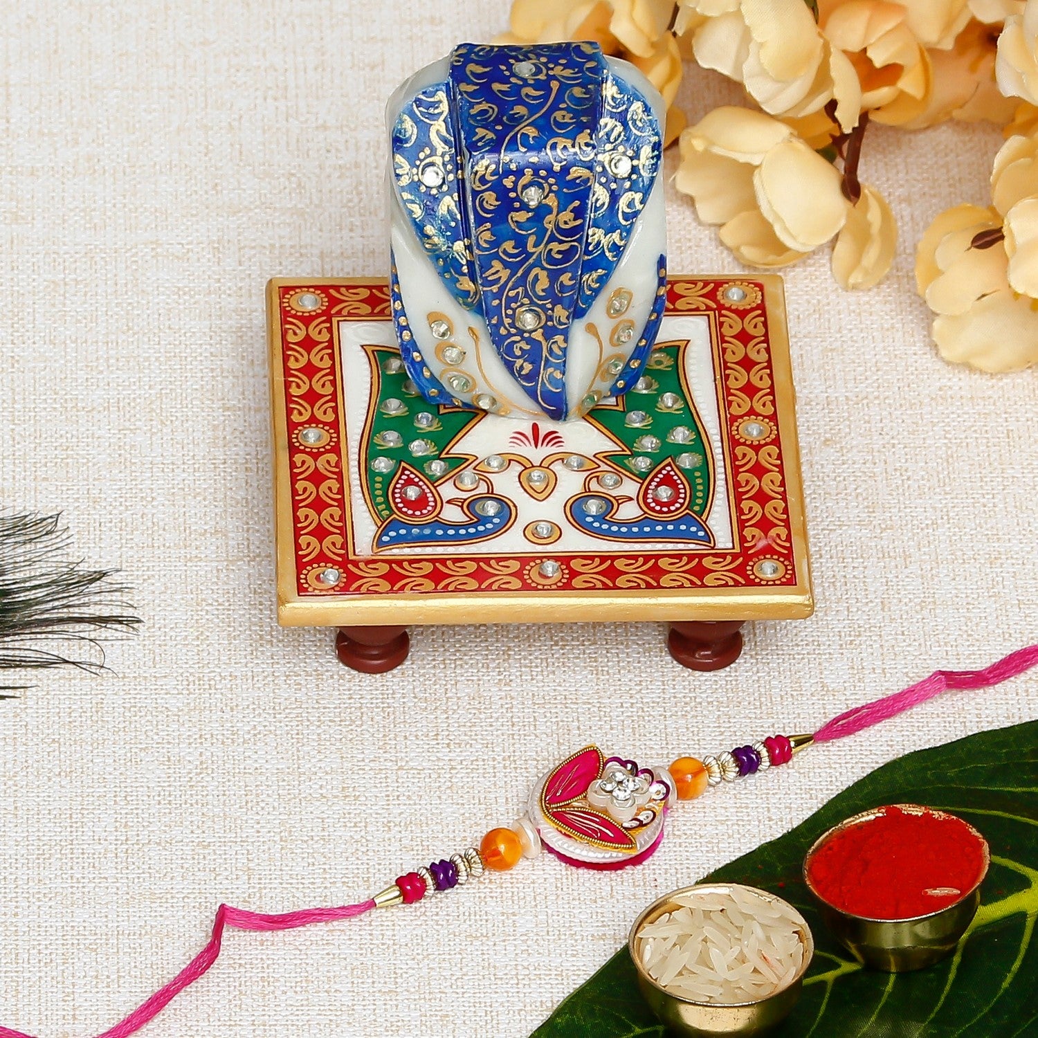 Designer Rakhi with Lord Ganesha on Marble Chowki and Roli Chawal Pack