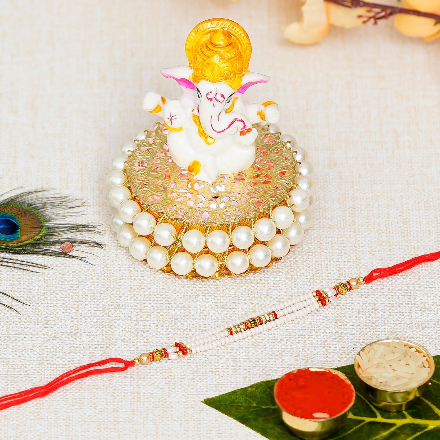 Designer Rakhi with Lord Ganesha Idol on Decorative Handcrafted Plate for Home and Car and Roli Chawal Pack