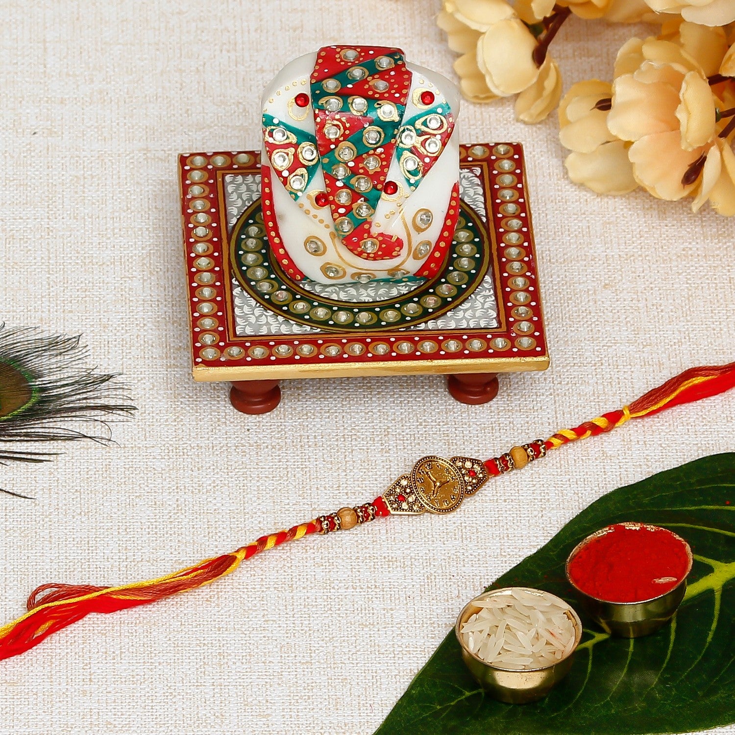 Designer Watch Pattern Rakhi with Lord Ganesha on Kundan Studded Marble Chowki and Roli Chawal Pack