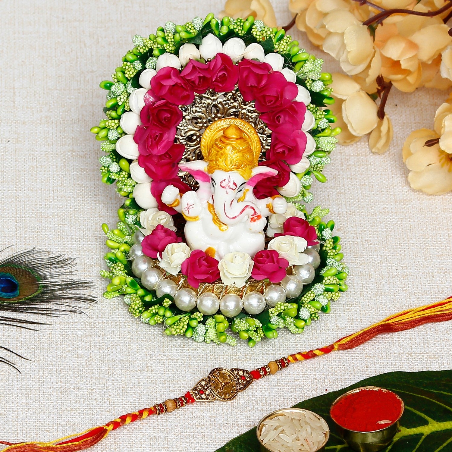 Designer Watch Pattern Rakhi with Lord Ganesha Idol on Decorative Handcrafted Green Floral Plate for Home and Car and Roli Chawal Pack