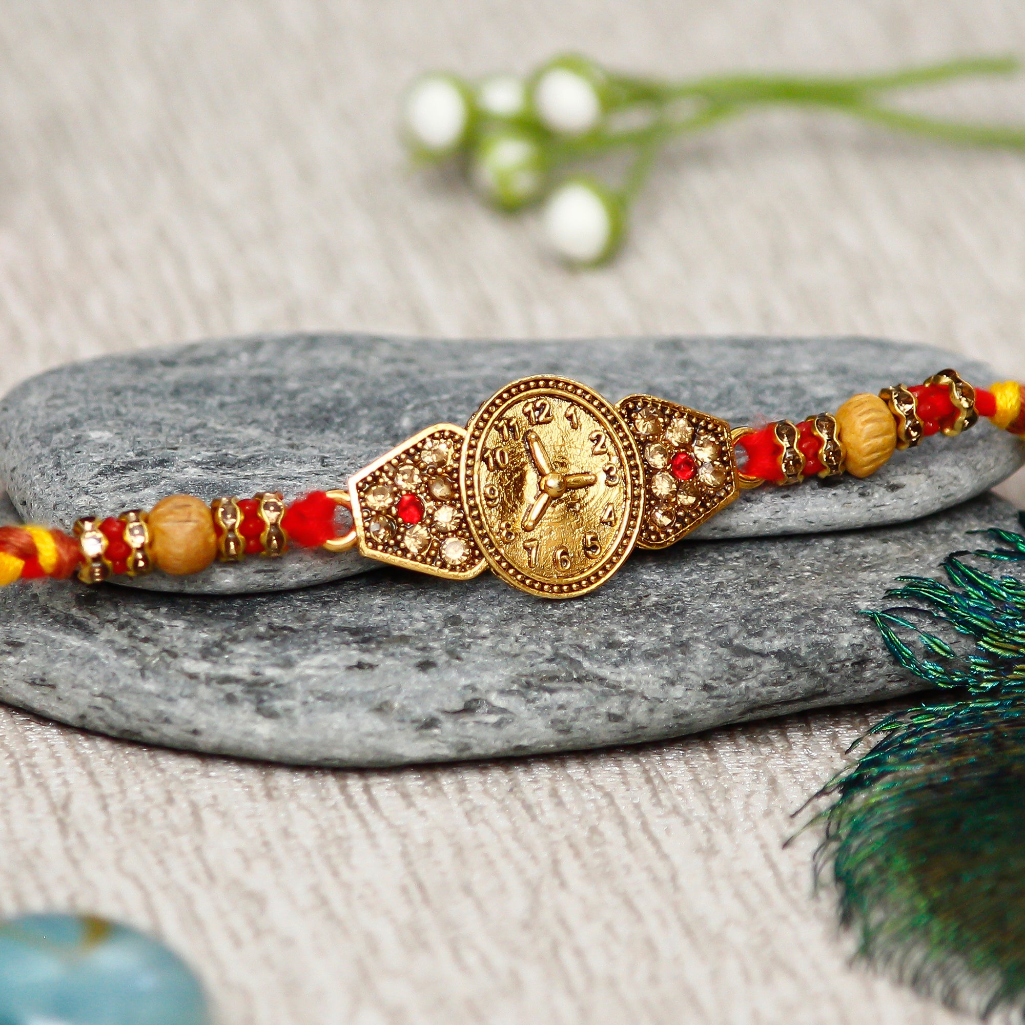 Designer Watch Pattern Rakhi with Lord Ganesha Idol on Decorative Handcrafted Green Floral Plate for Home and Car and Roli Chawal Pack 1