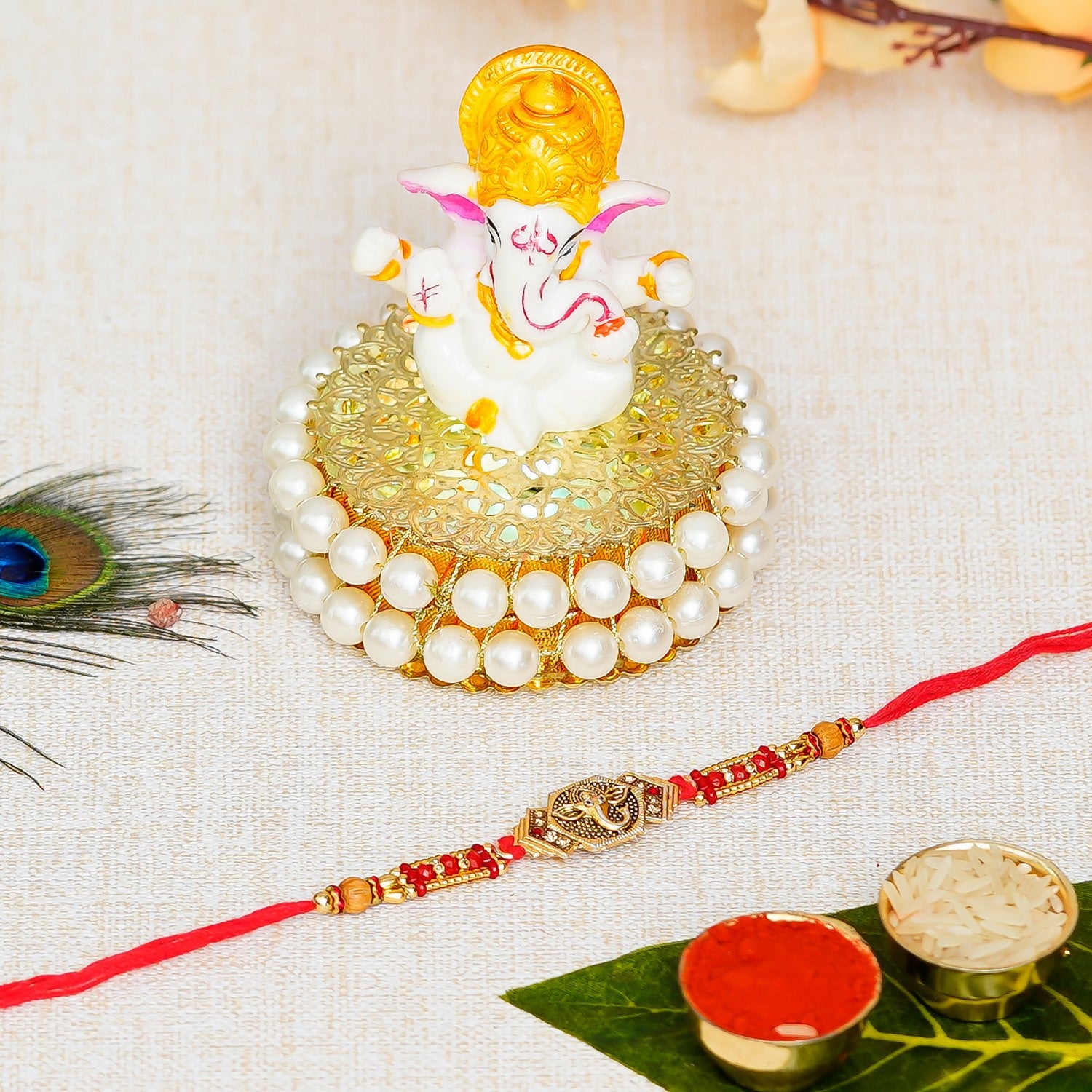 Designer Ganesha Rakhi with Lord Ganesha Idol on Decorative Handcrafted Plate for Home and Car and Roli Chawal Pack