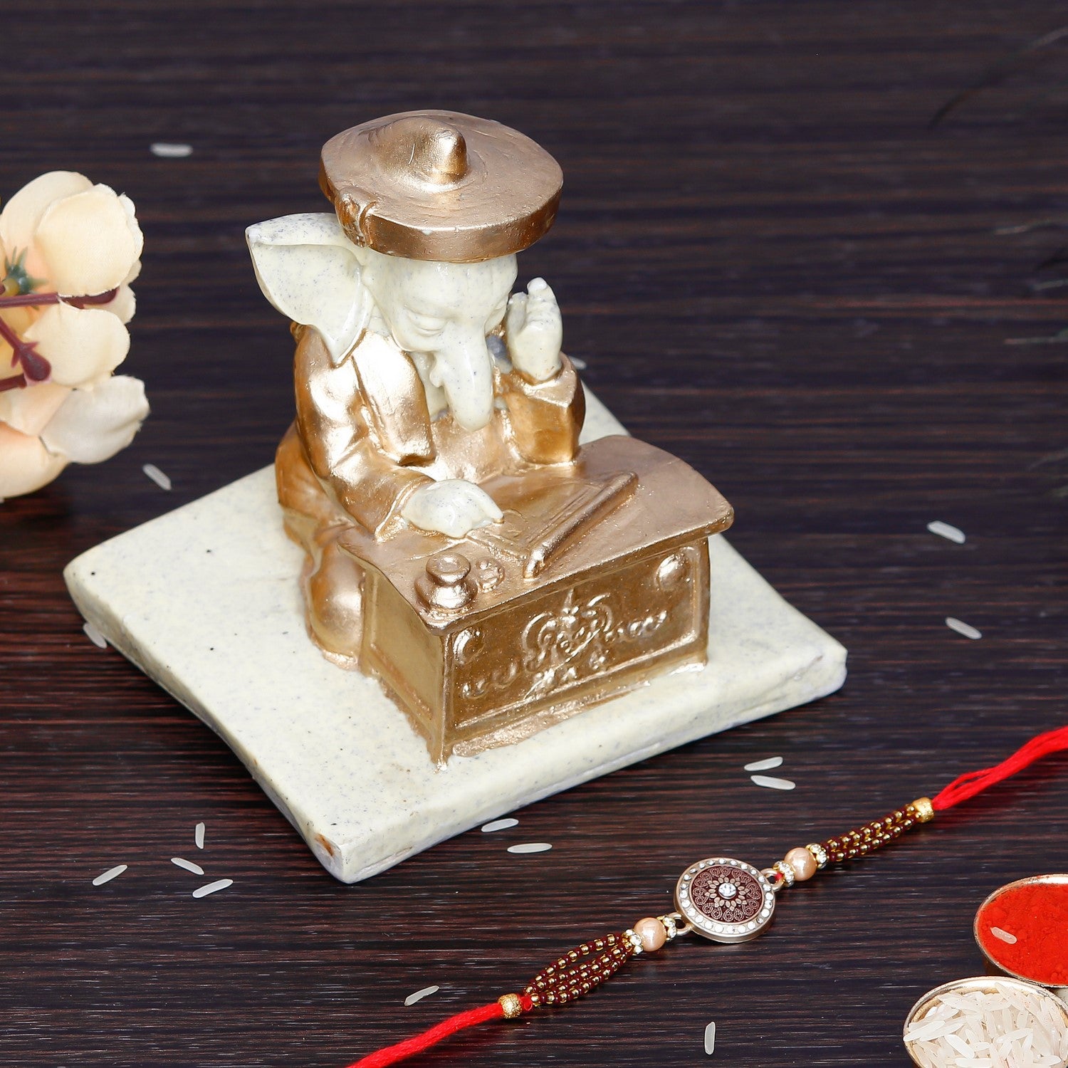 Designer Rakhi with Handcrafted Ganesha Showpiece and Roli Chawal Pack