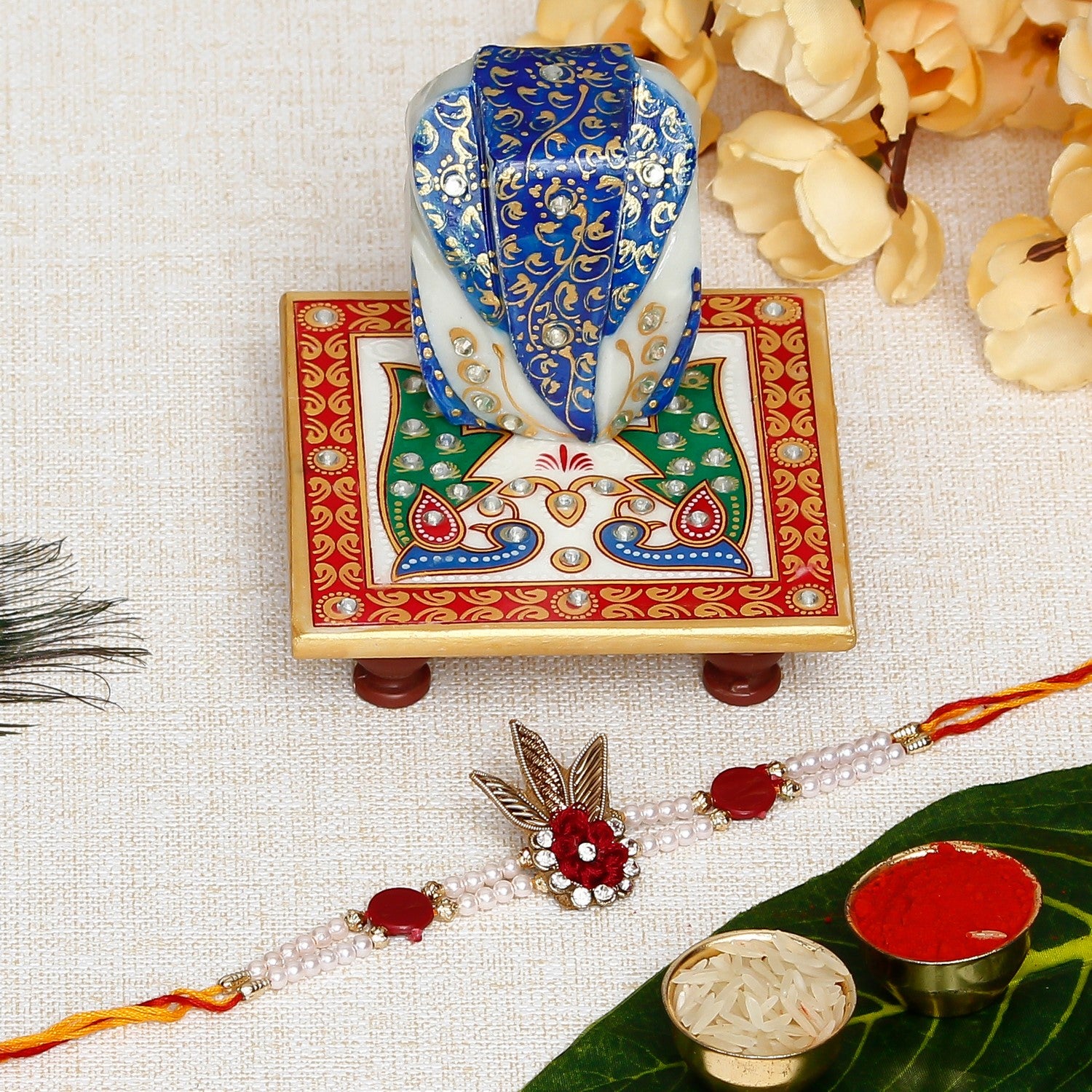 Designer  Handcrafted Rakhi with Lord Ganesha on Marble Chowki and Roli Chawal Pack
