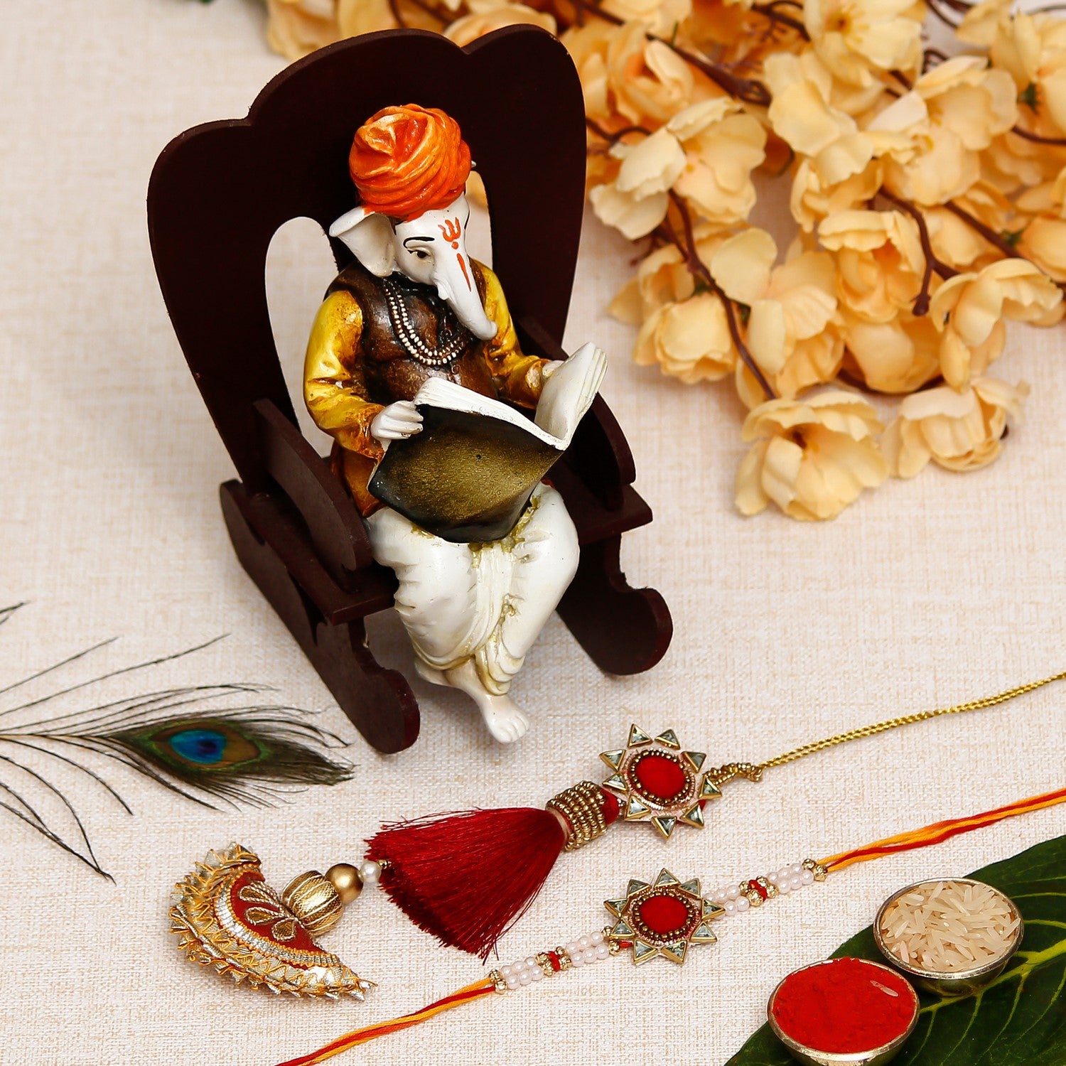 Designer Handcrafted Premium Bhaiya Bhabhi Rakhi with Lord Ganesha reading Book on Wooden Chair and Roli Chawal Pack