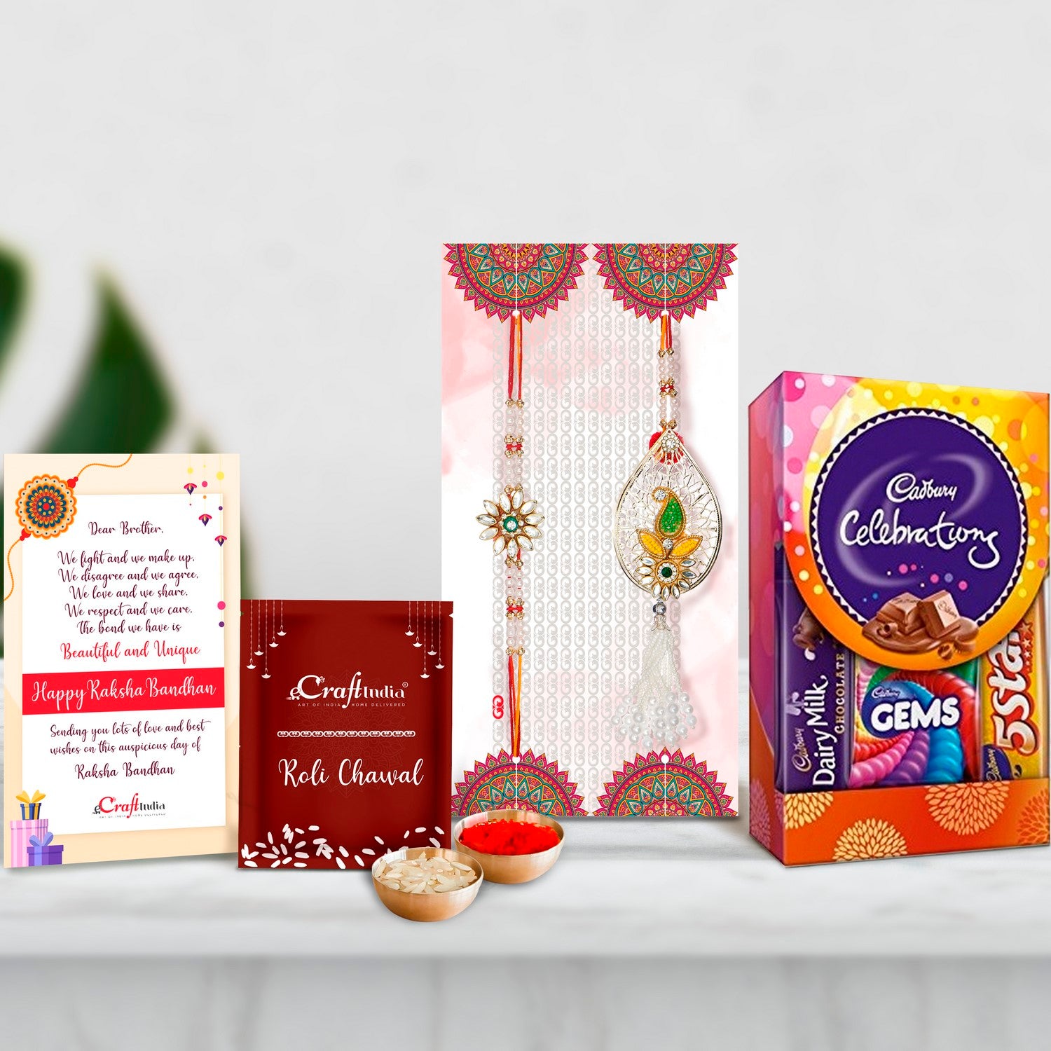 Designer Handcrafted Premium Bhaiya Bhabhi Rakhi with Cadbury Celebrations Gift Pack of 5 Assorted Chocolates and Roli Chawal Pack, Best Wishes Greeting Card