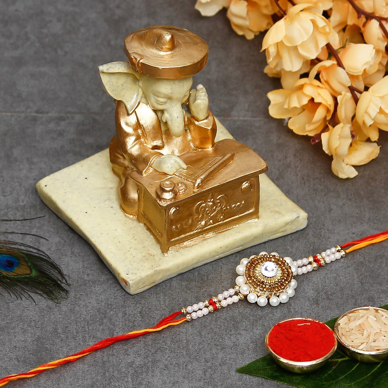 Desginer Stone and Pearl Rakhi with Handcrafted Ganesha Showpiece and Roli Chawal Pack