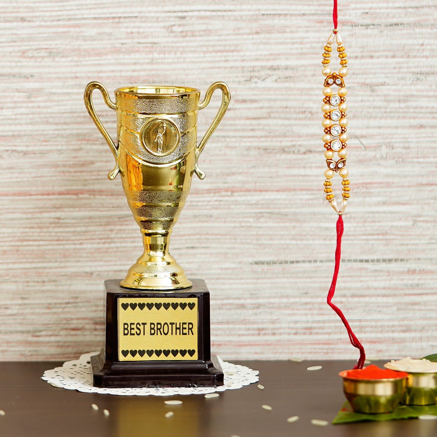 Designer Handcrafted Rakhi with Best Brother Trophy and Roli Chawal Pack