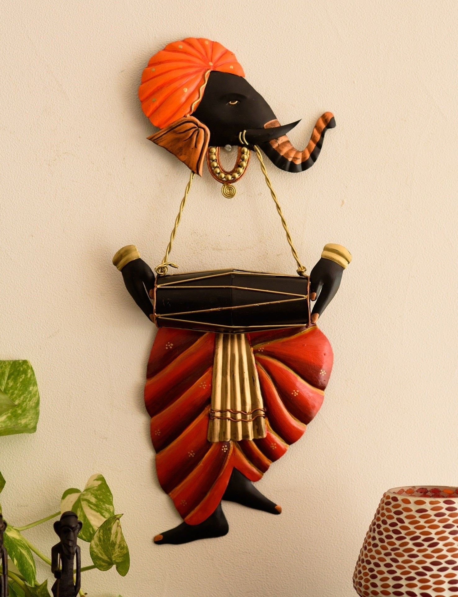 Orange and Black Wrought Iron Lord Ganesha Playing Dholak Wall Hanging