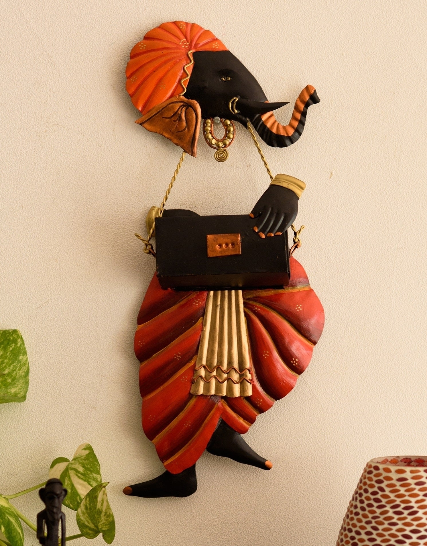 Orange and Black Wrought Iron Lord Ganesha playing Harmonium Wall Hanging