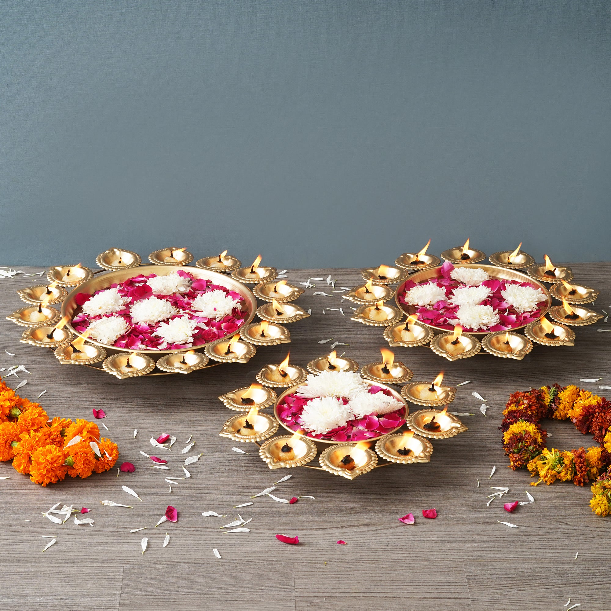 eCraftIndia Set of 3 Golden Metal Handcrafted Flower Shape Designer Urlis with Diyas 1