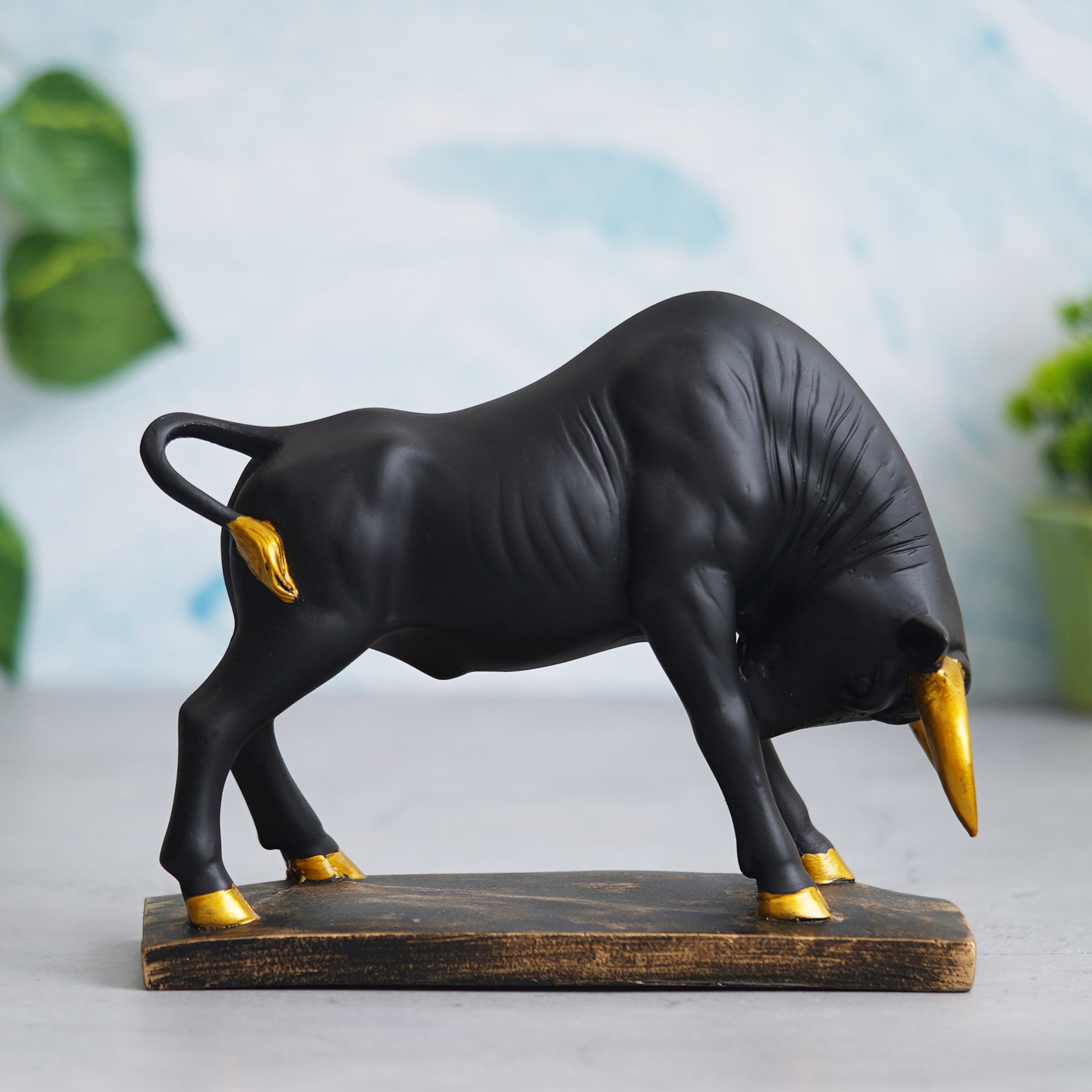 eCraftIndia Black and Golden Polyresin Charging Bull Statue Animal Figurine Decorative Showpiece