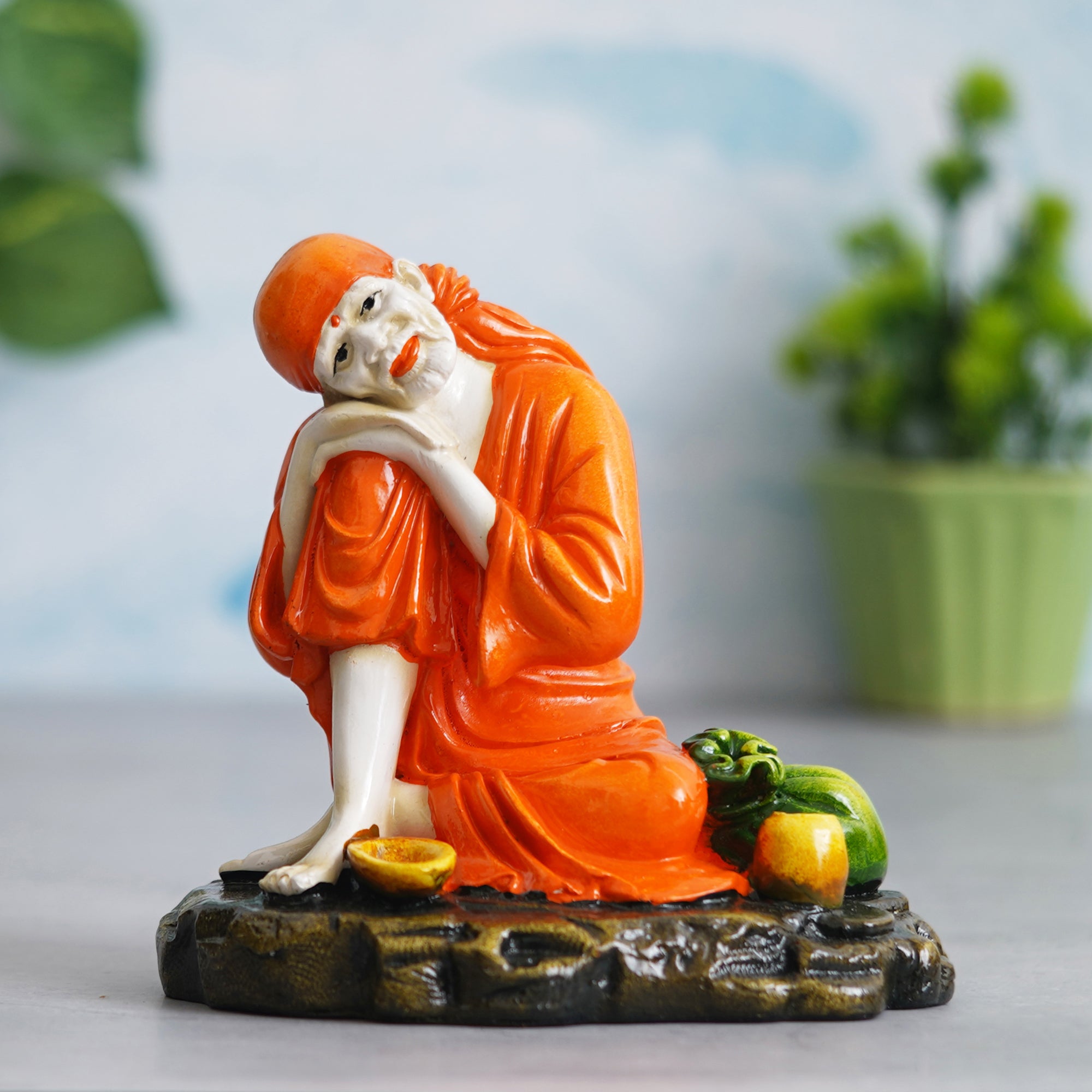 eCraftIndia Orange Polyresin Handcrafted Sai Baba Idol Resting on his Knee 4